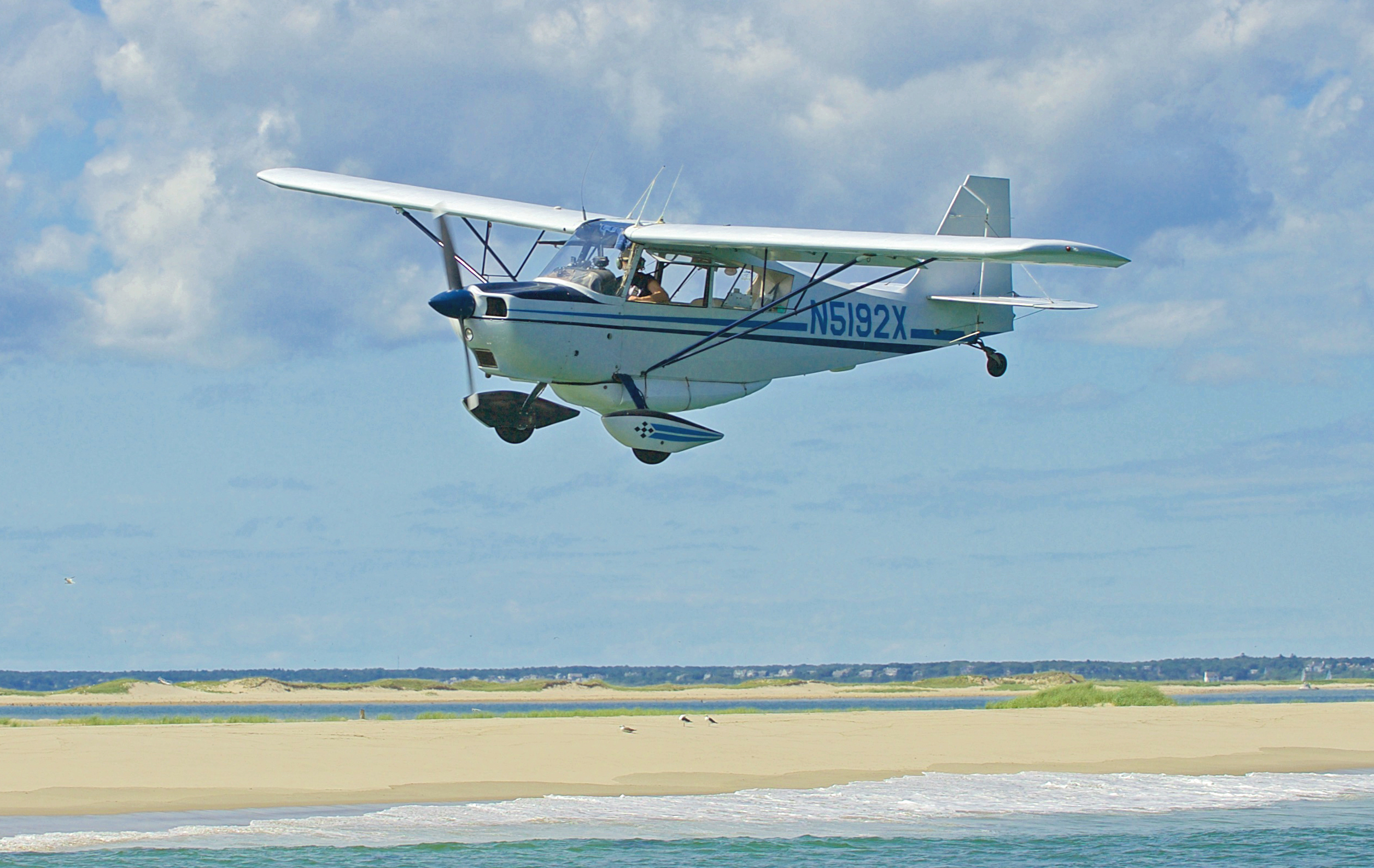 Twice a week, Wayne Davis flies his single-engine plane along the Cape Cod coast looking for sharks.