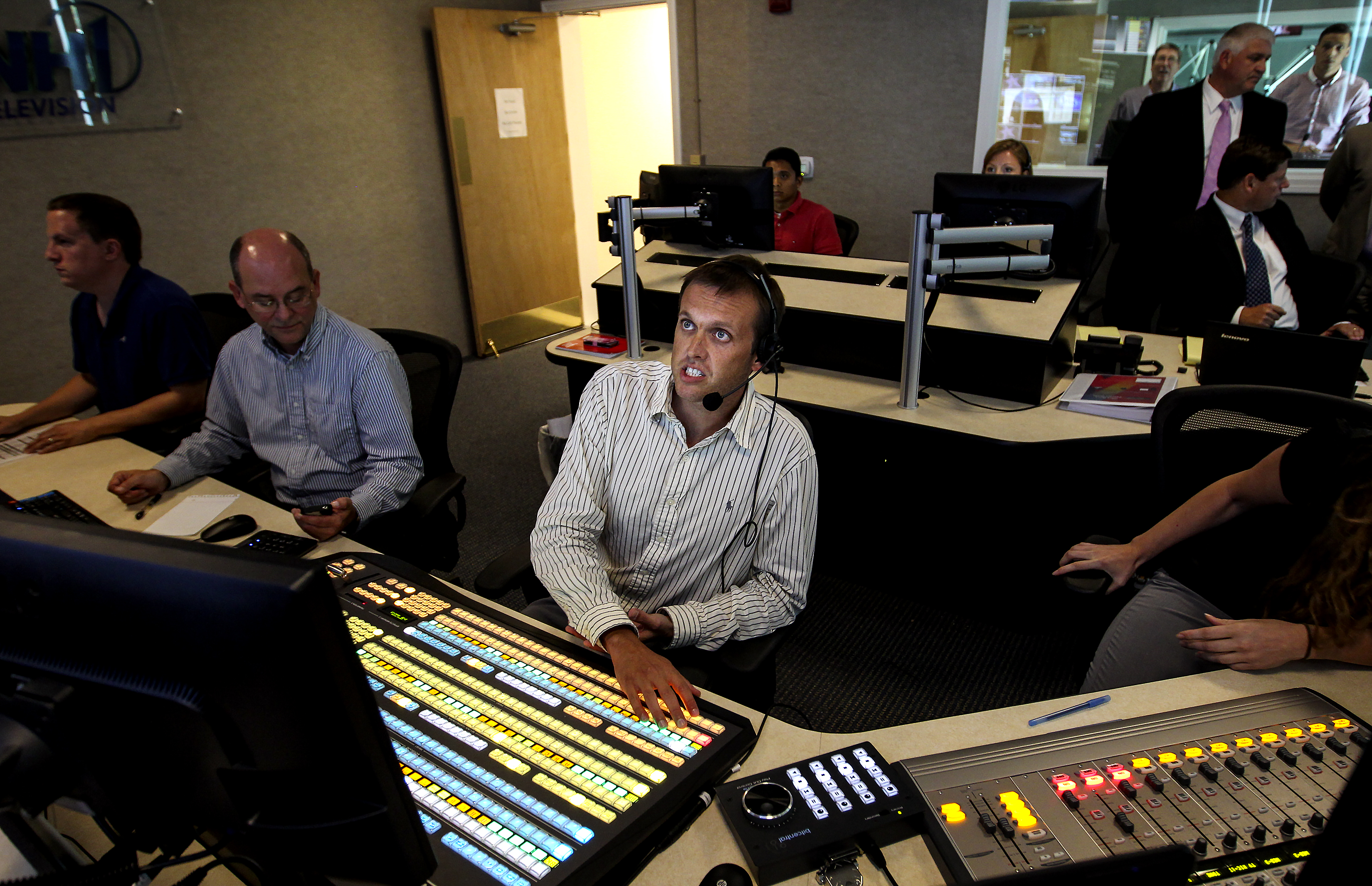 Director Ben Sparling, facing center, monitored NH1 News from the production control room during TV news rehearsals.
