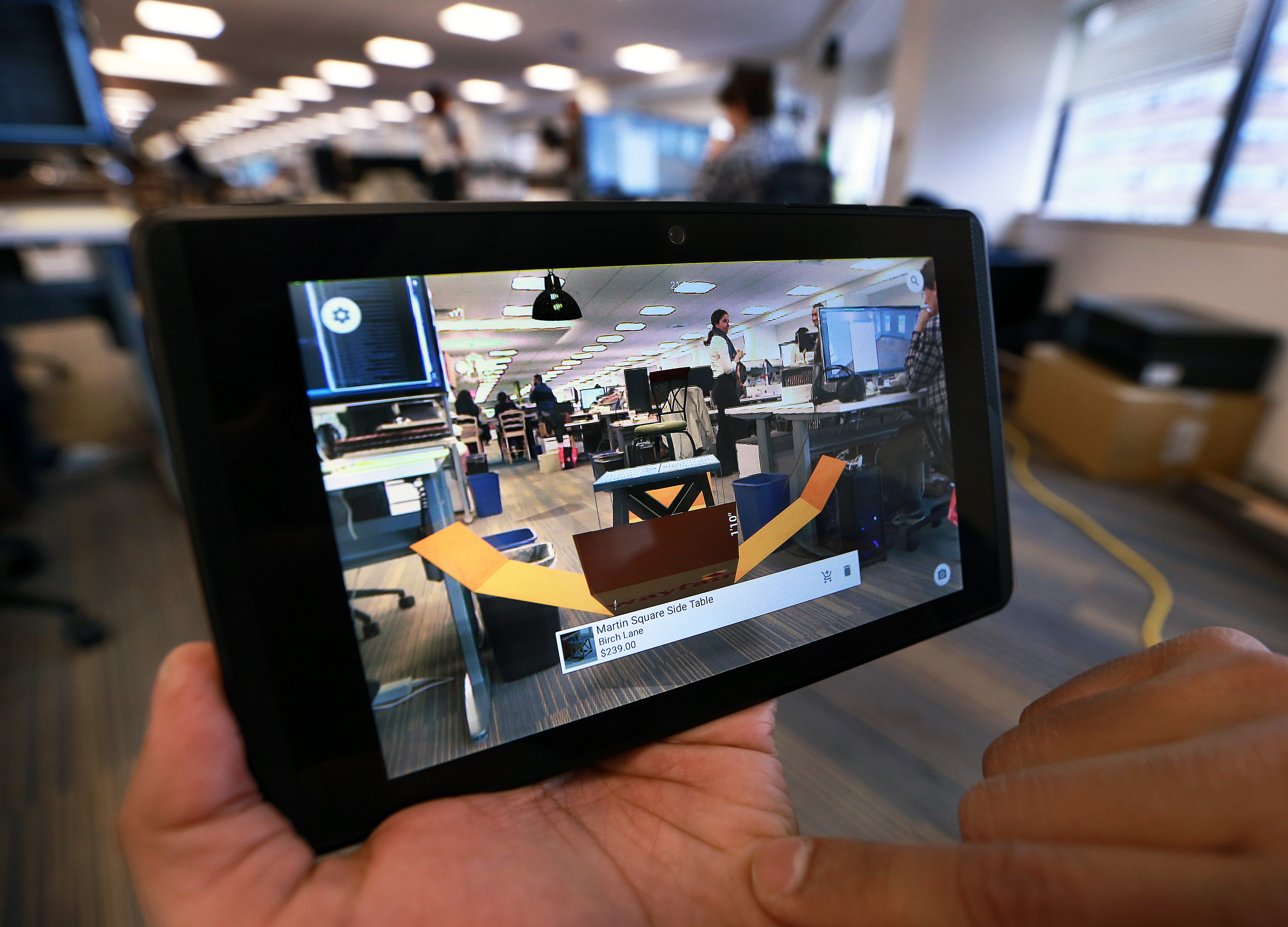 Shrenik Sadalgi demonstrated how to use the app that superimposes furniture from Wayfair's collection in his phone's camera.