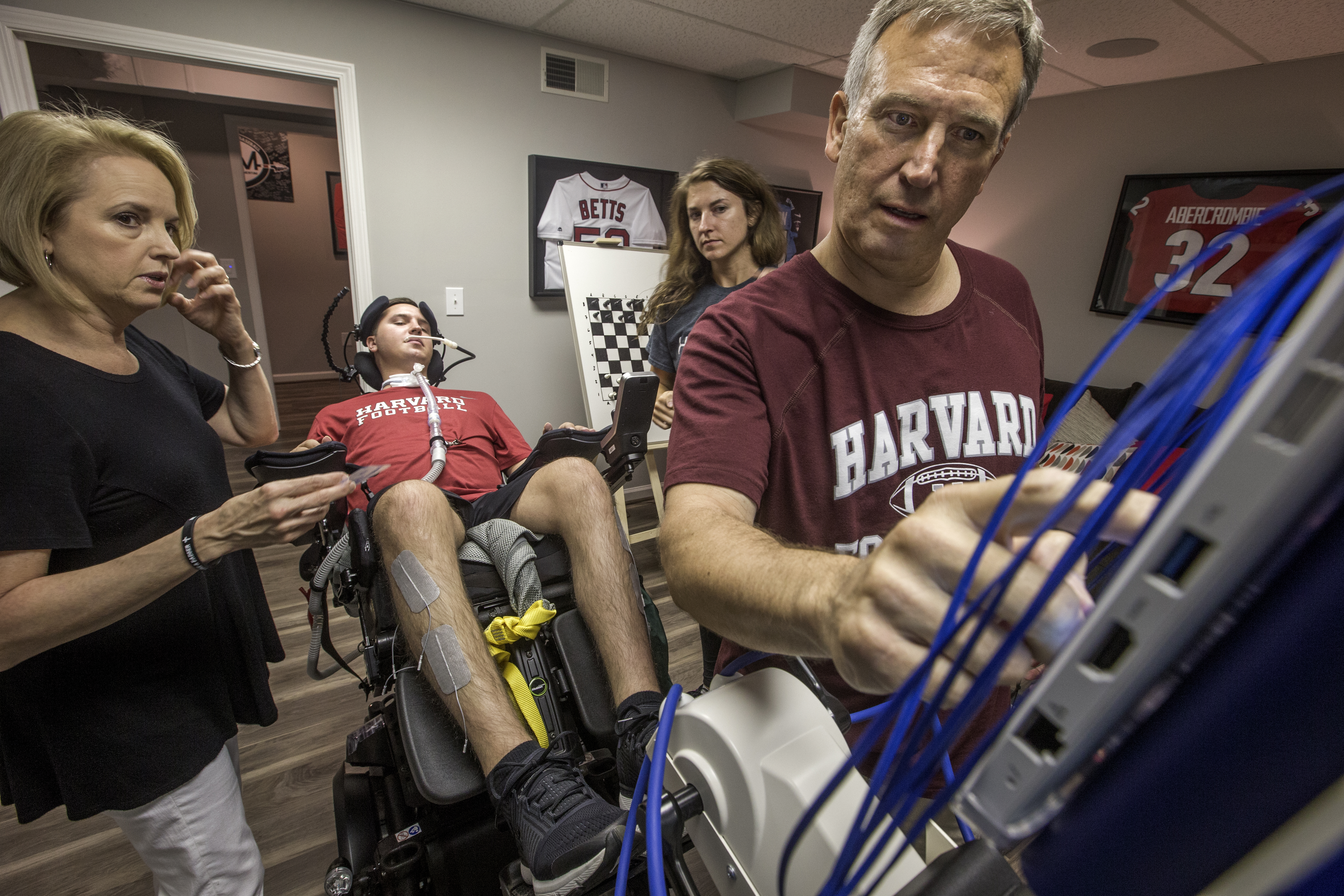 Ben’s dad Marty (right), his mom Sherri (left), and personal trainer Chelsea Henderson, who is also Ben’s first cousin, help out.