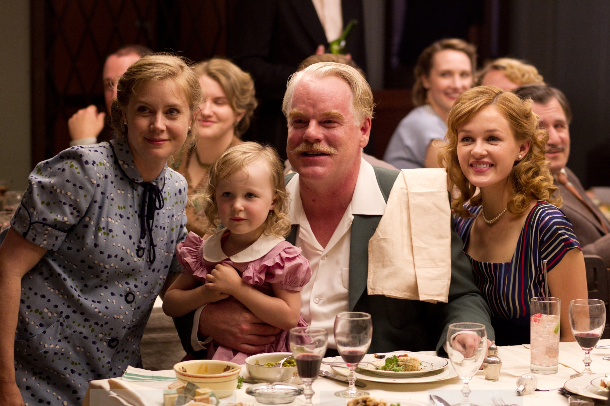 Amy Adams (left) and Philip Seymour Hoffman (center) in “The Master.’’