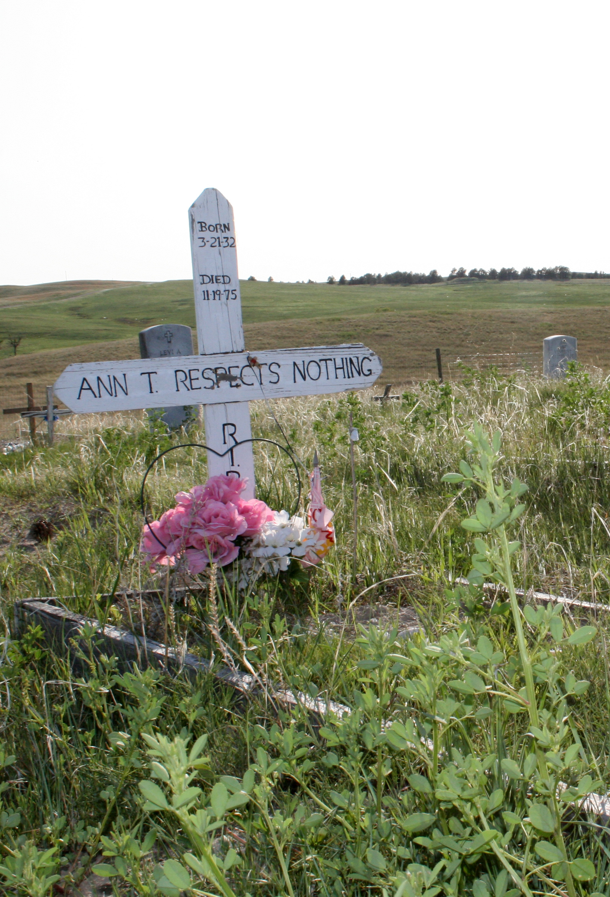 A cross adorned a grave at the Wounded Knee National Historic Landmark in South Dakota.