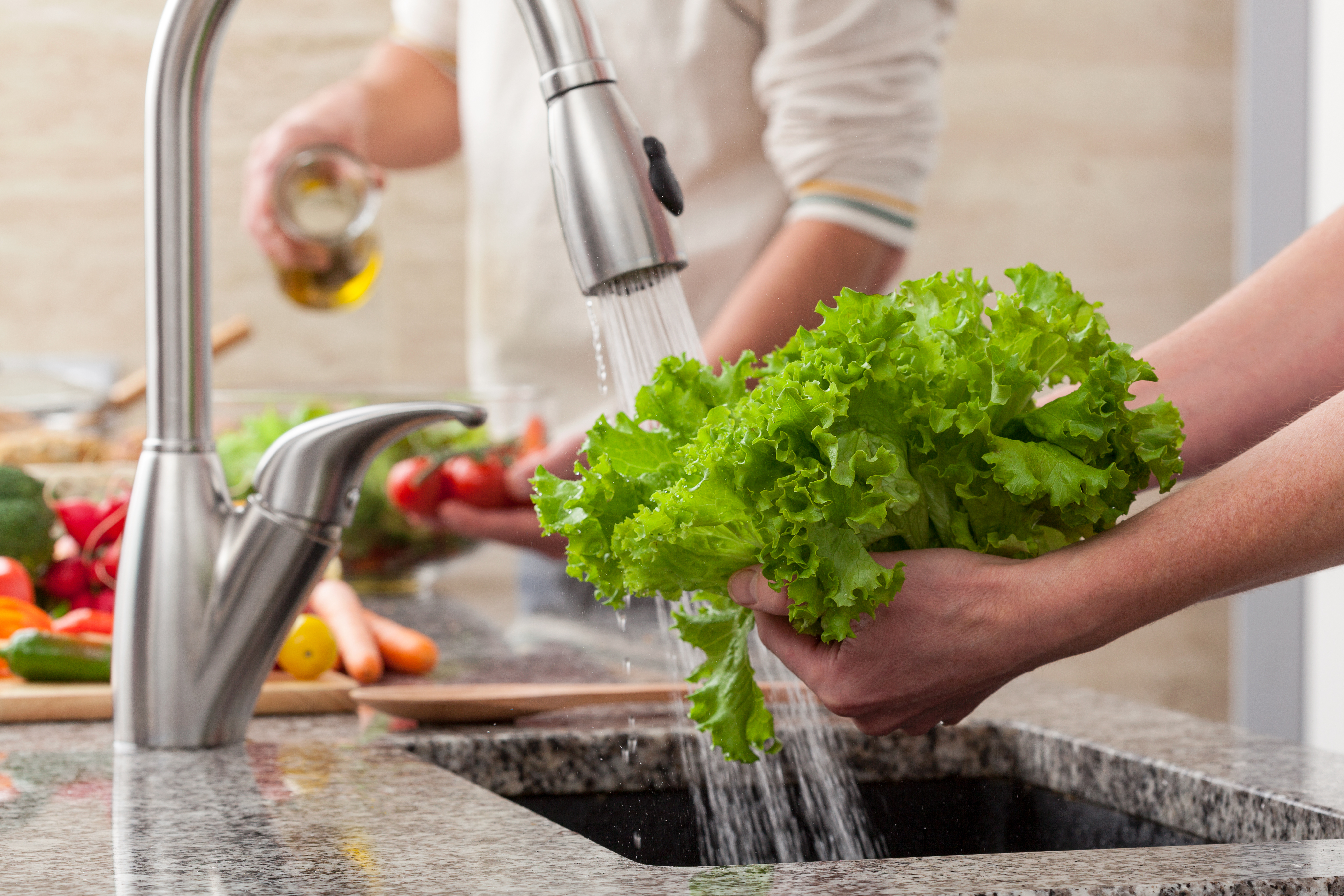 Washing veggies won’t completely zap your risk, but it does help.