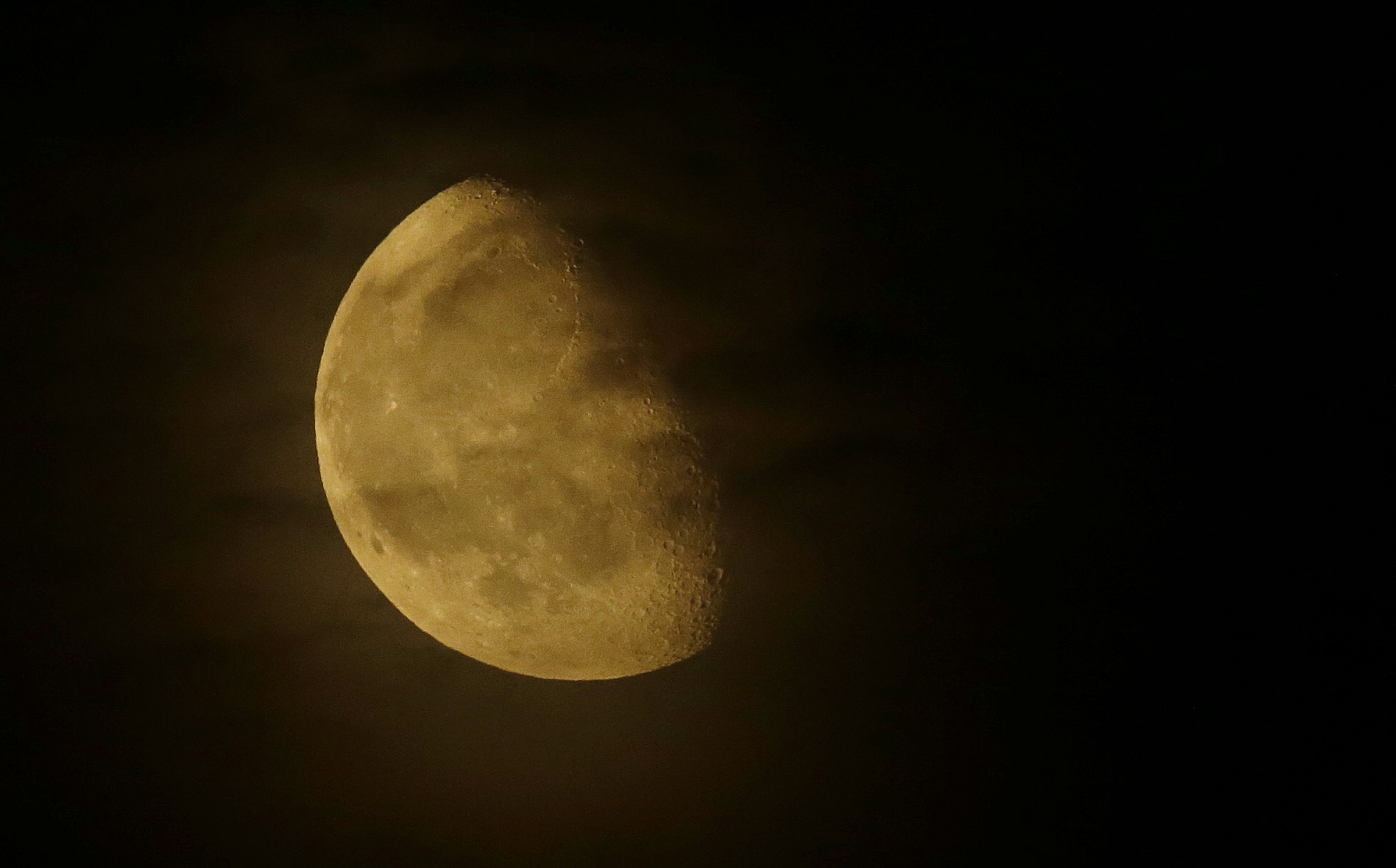 Smoke from the wildfires made the moon appear yellow.