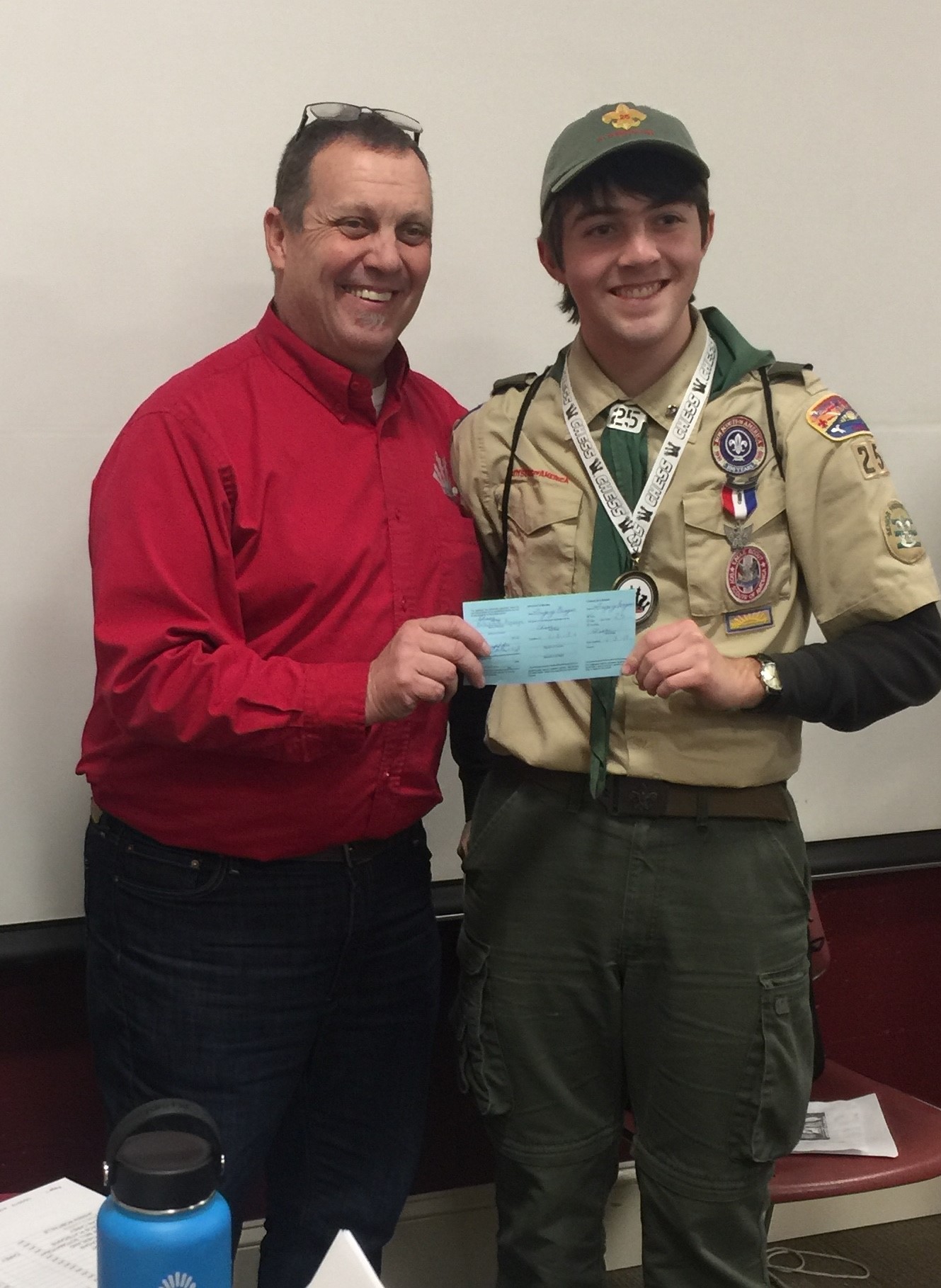 Bob Salvas, merit badge counselor, stands with Gregory Beagan (right) at Rhode Island College, where Beagan earned his final merit badge.