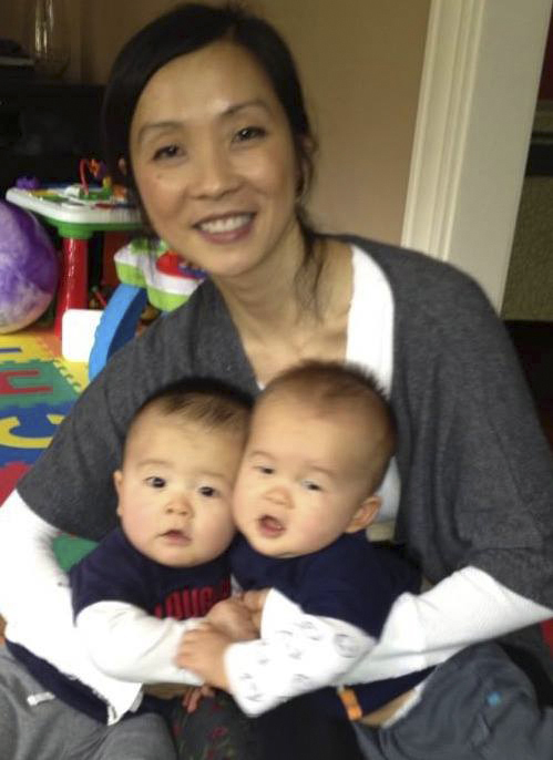 Mei Kum Jones of Arlington, with her twin boys, Colt and Cameron.
