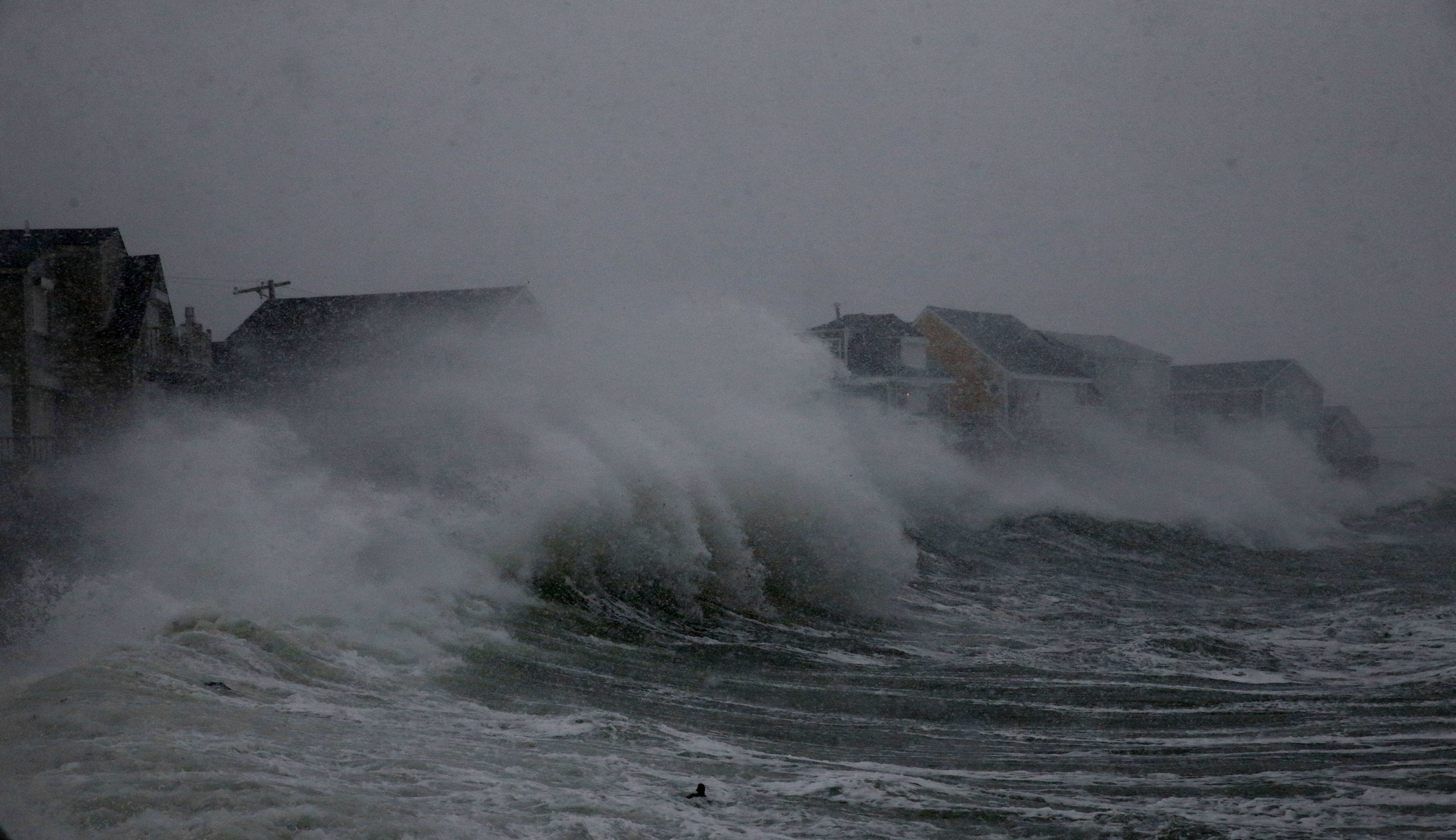 Waves crashed against homes on Turner Road in Scituate.