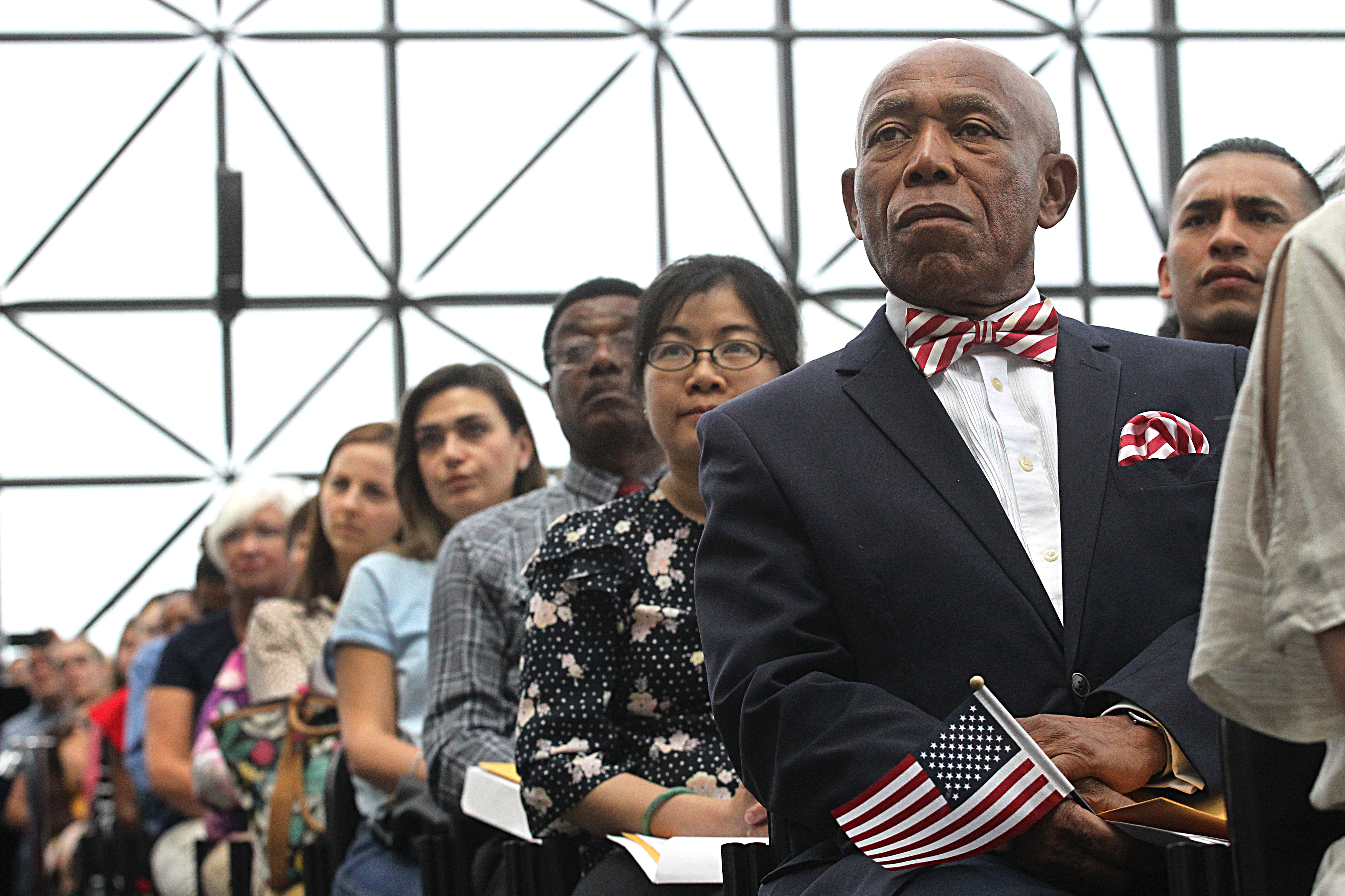 Fritz Orvil, who was sworn in as a US citizen listened to the speakers at the ceremony.