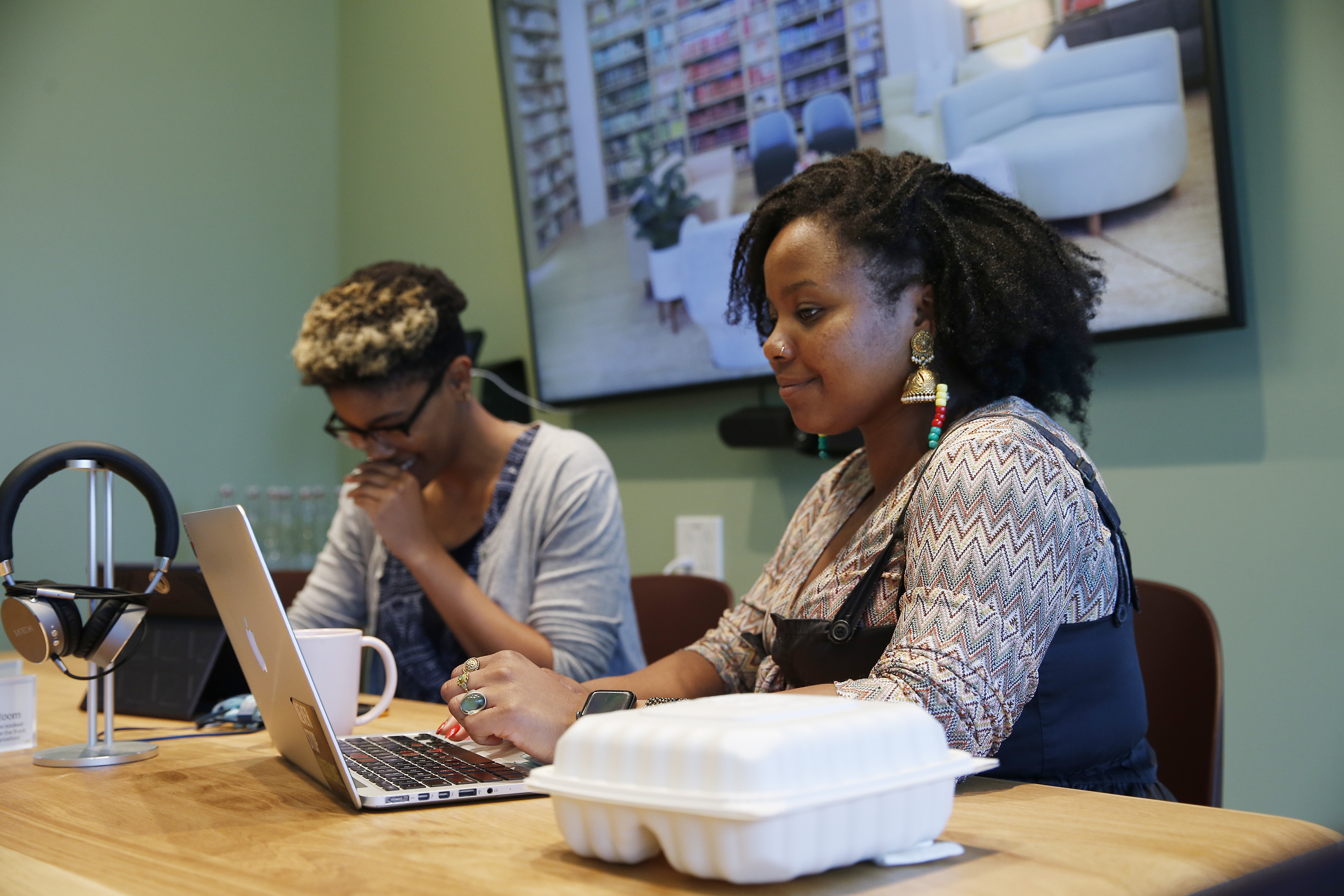 Netia McCray (left) works with Dextina Booker, MIT grad student and curriculum lead for Boston Design Academy.