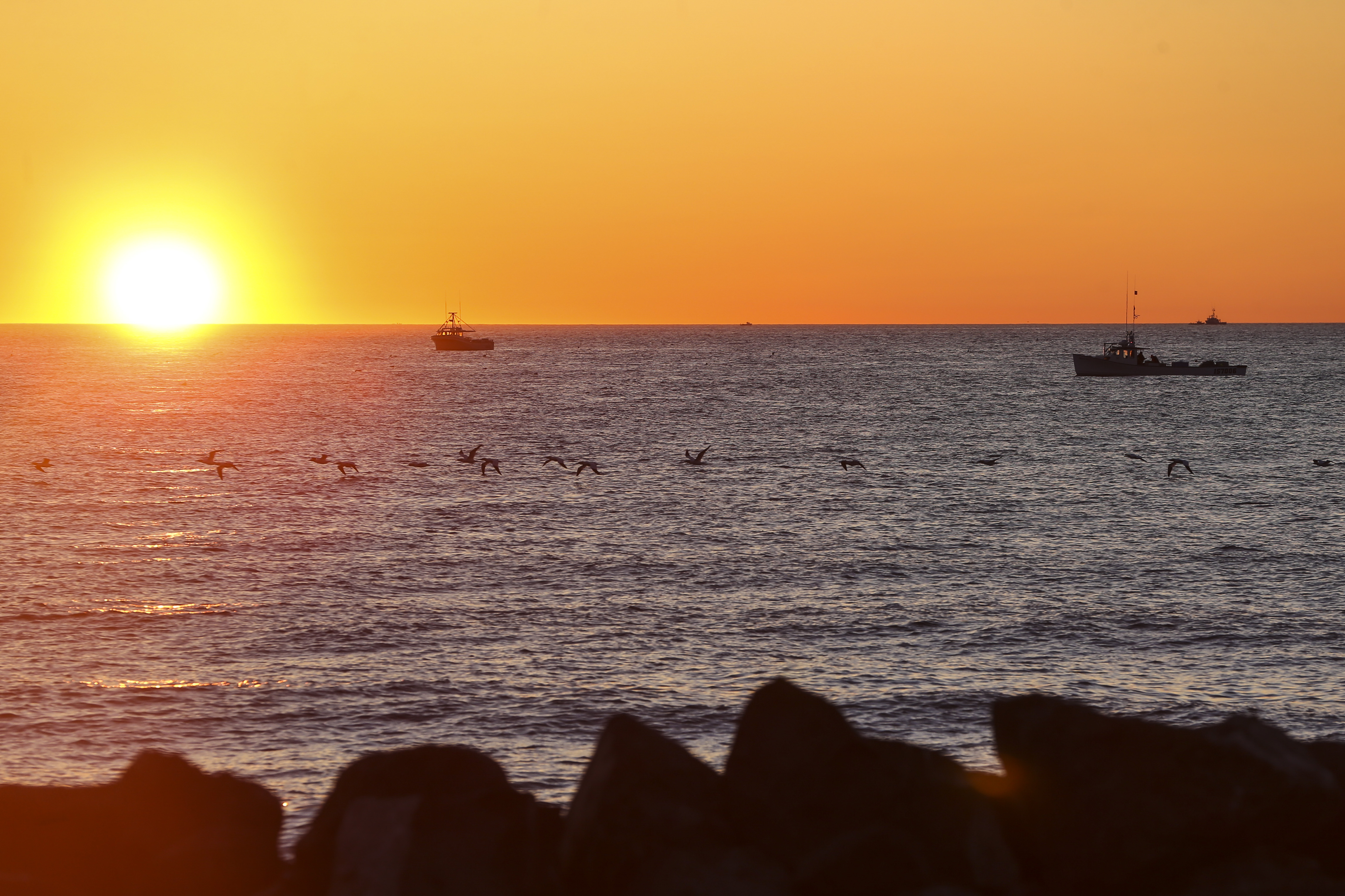 Lobstermen fished off of Miscou Island at sunrise.