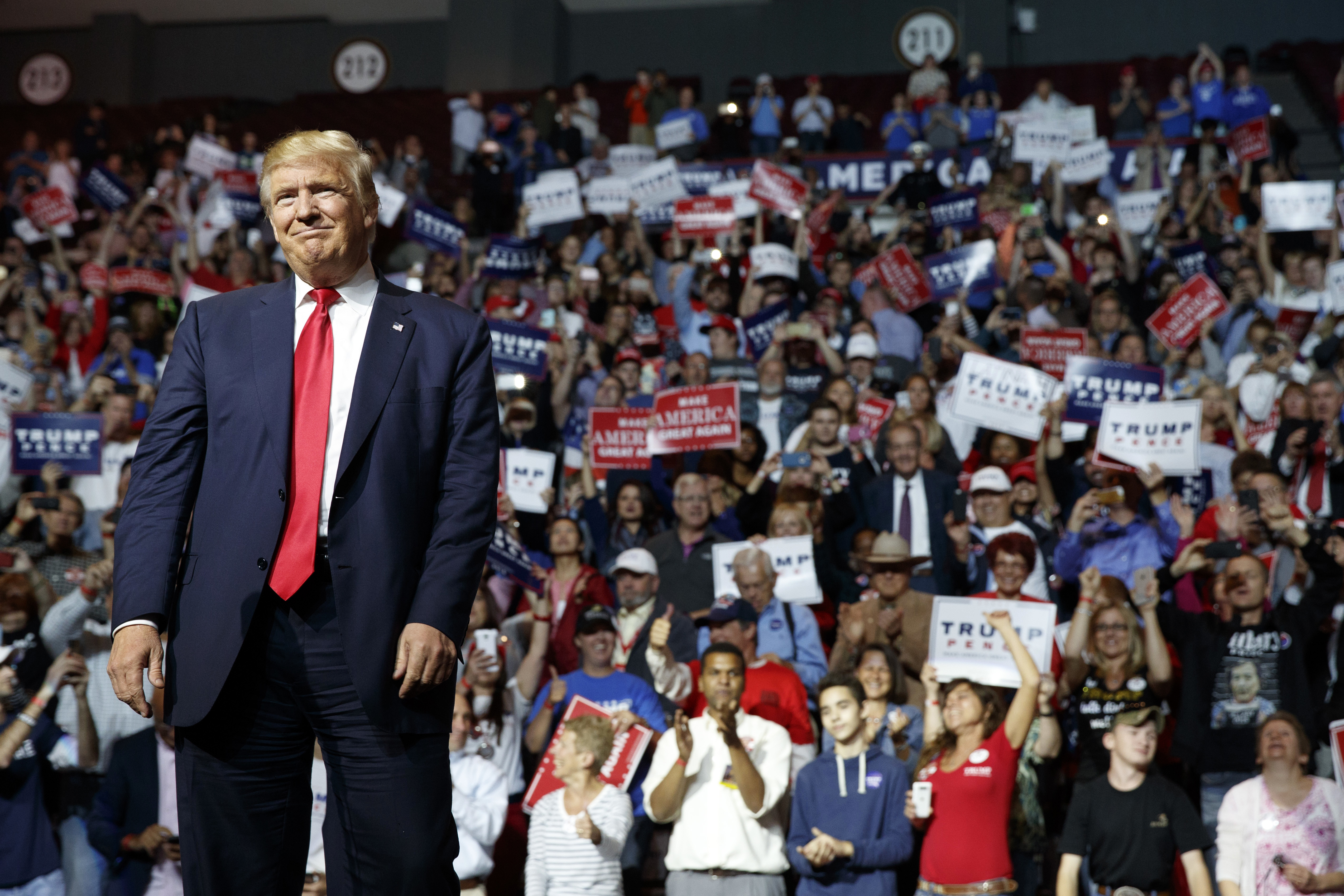 Republican presidential candidate Donald Trump paused as he arrived to speak at the Cincinnati rally.