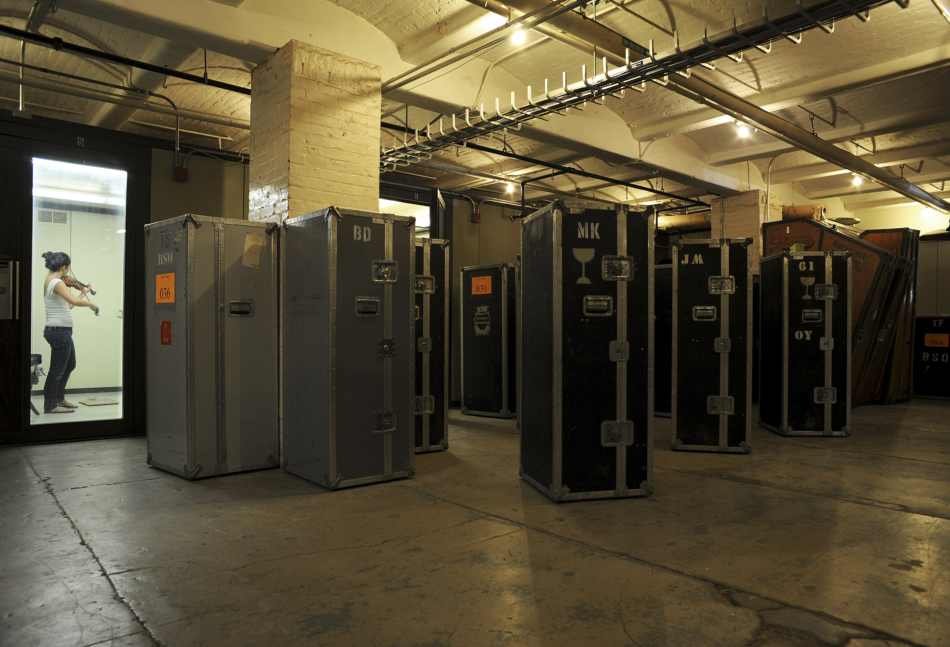 Ming Tanigaw-Lau used a practice room at the Boston Symphony Orchestra surrounded by cargo cases for the Asia tour.