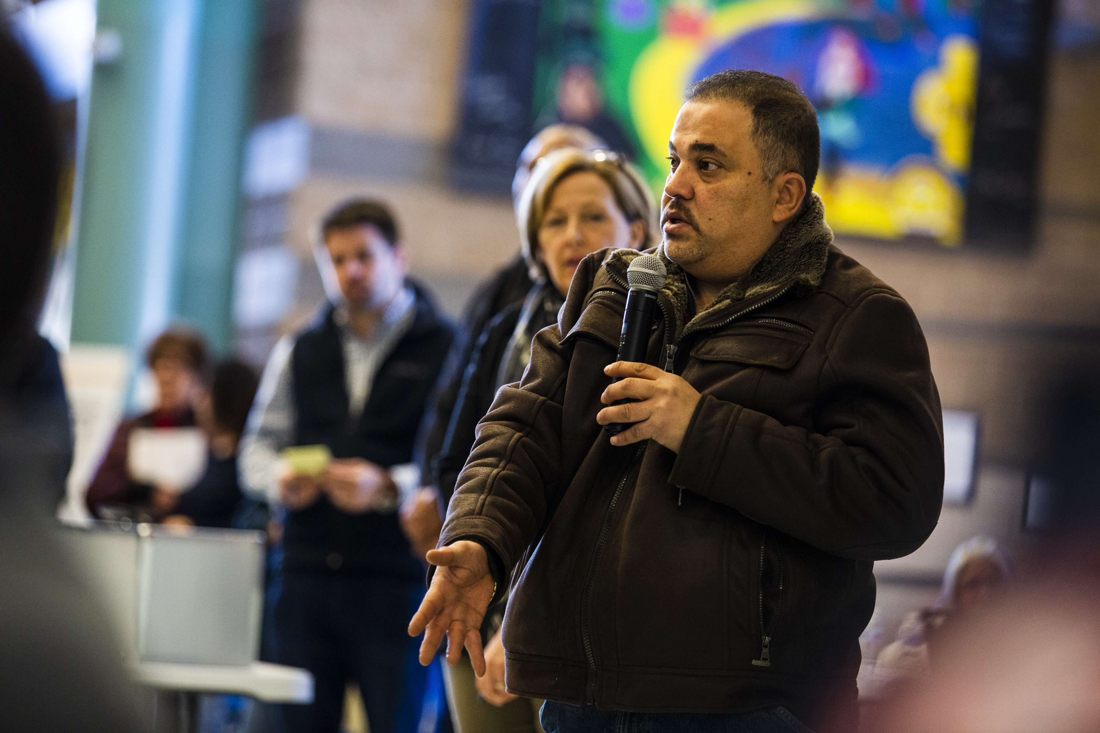 Lawrence resident Emad Awad, owner of Riverside Pizzeria, spoke during a meeting at Lawrence High School.