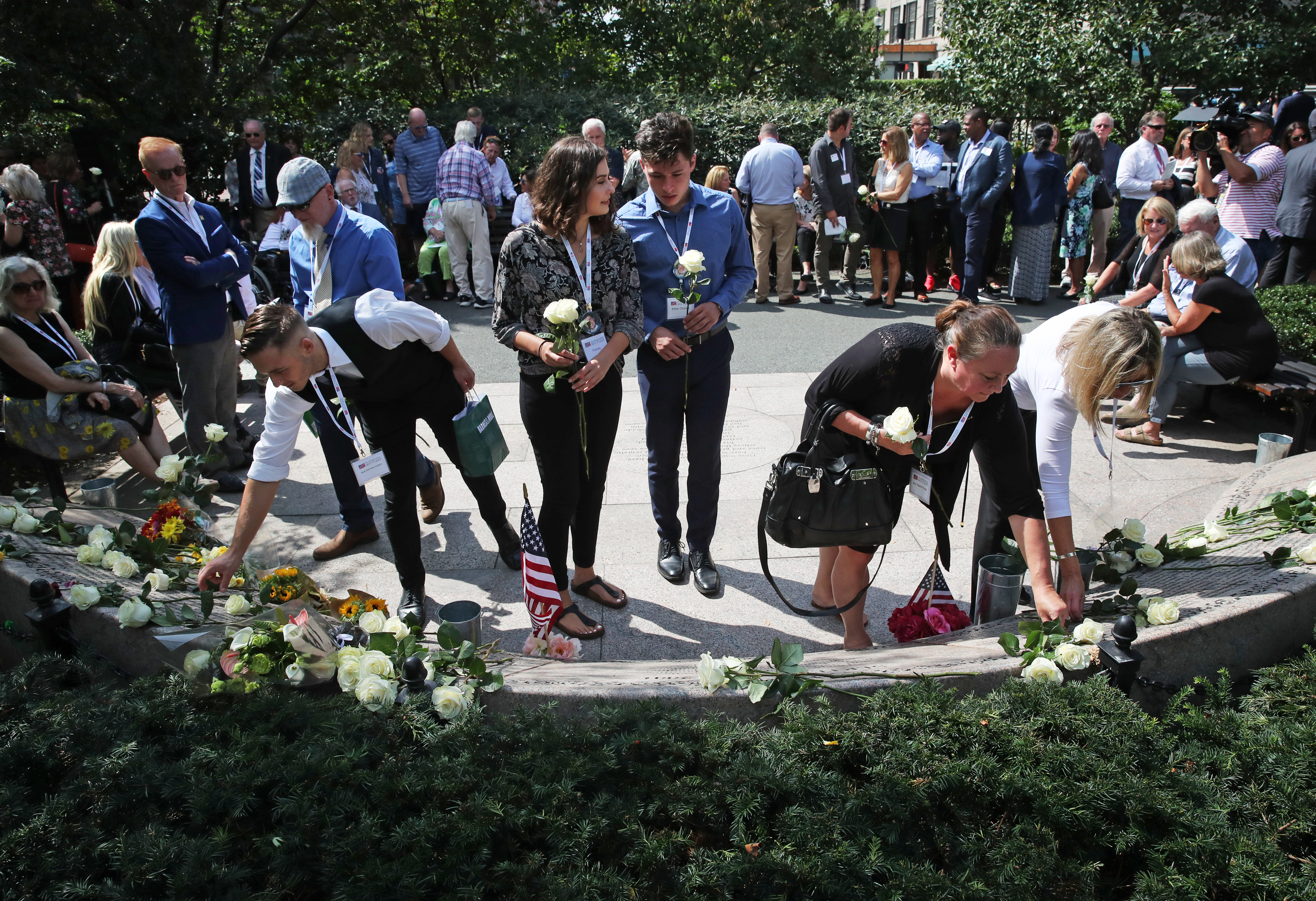 Family members of victims placed roses at the Public Garden.