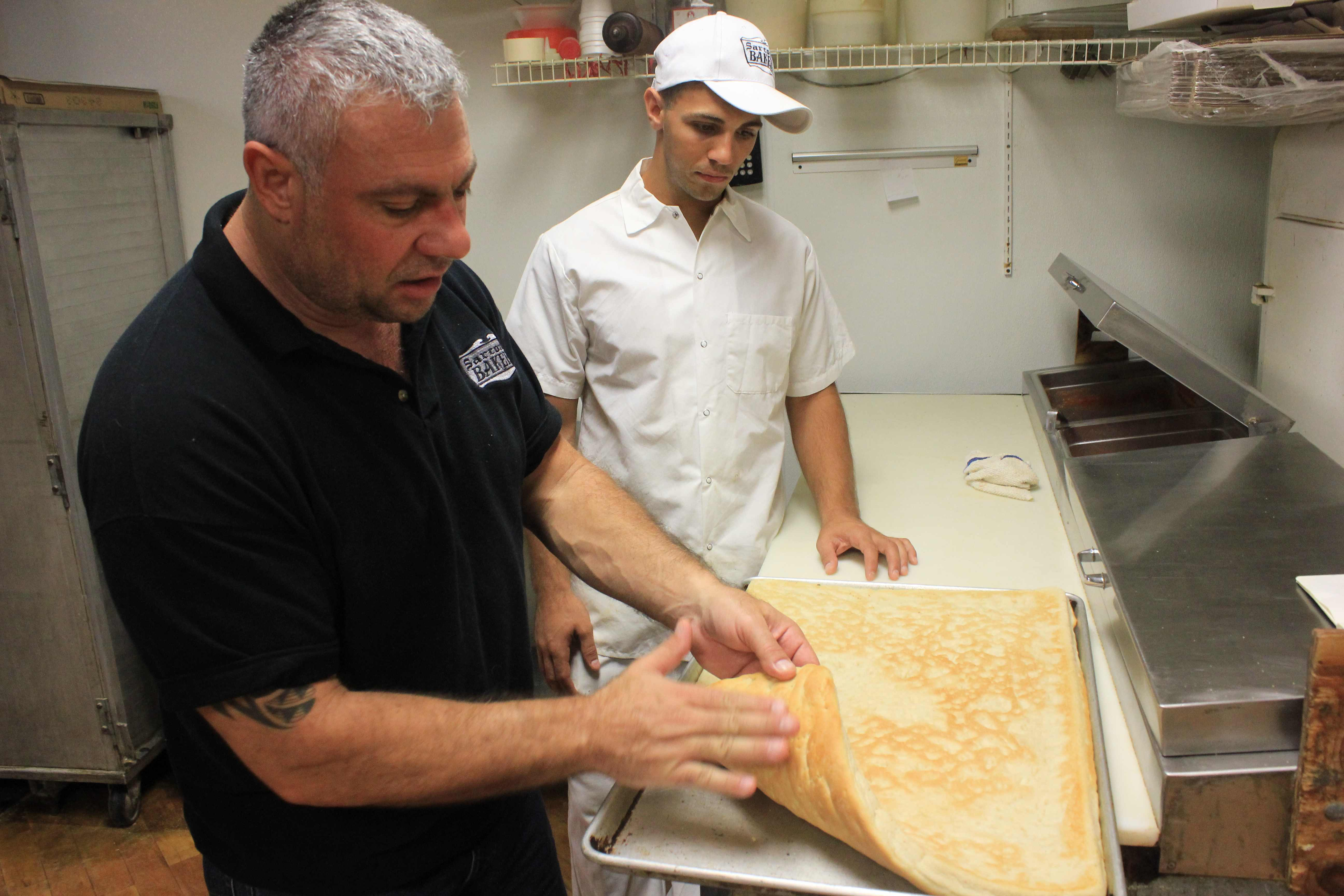 Louis Sarcone Jr. (right, with Louis Sarcone III) is fourth-generation owner of Sarcone’s, also in Philly.