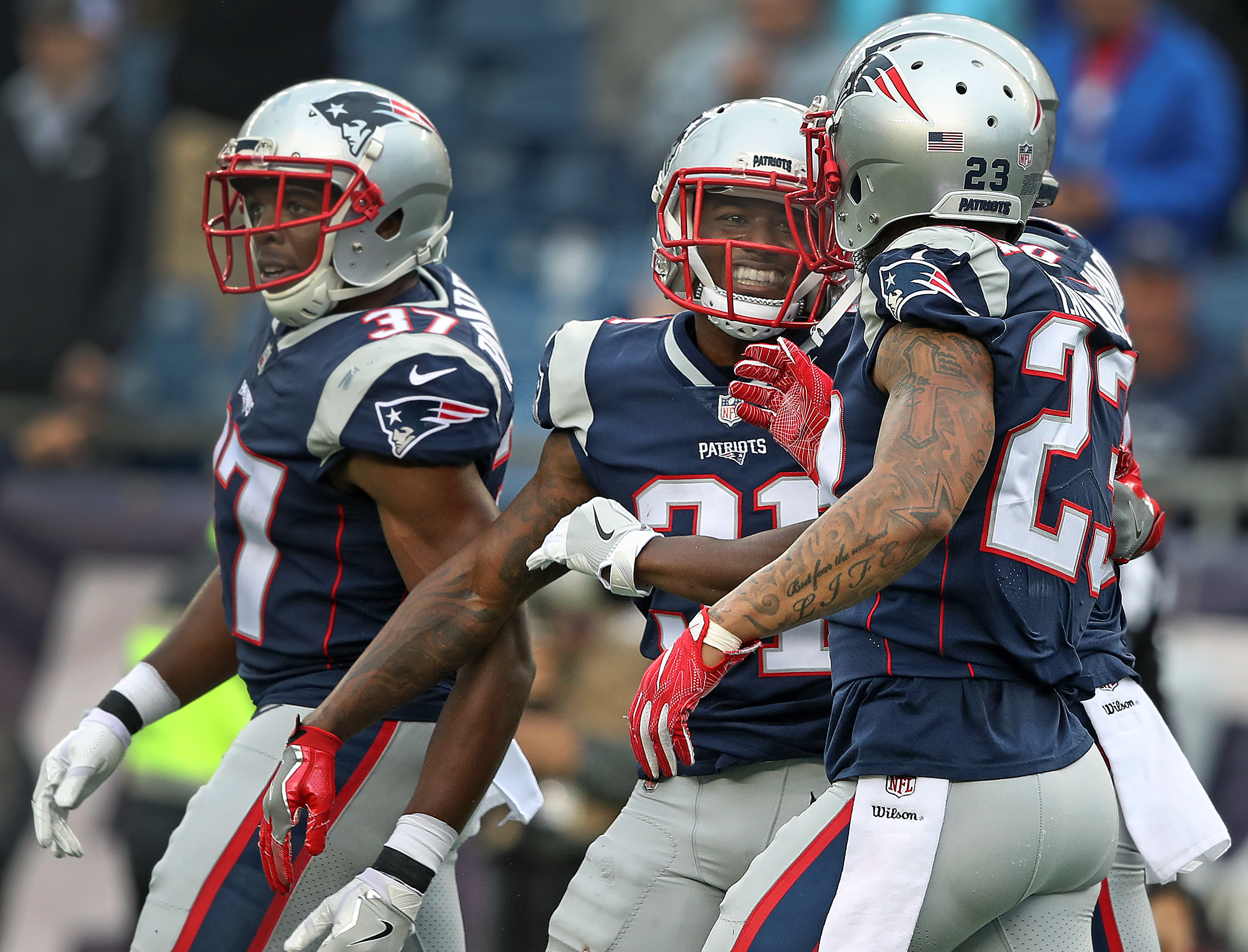 Jonathan Jones (center) sealed the victory with an interception on the final play of the game.