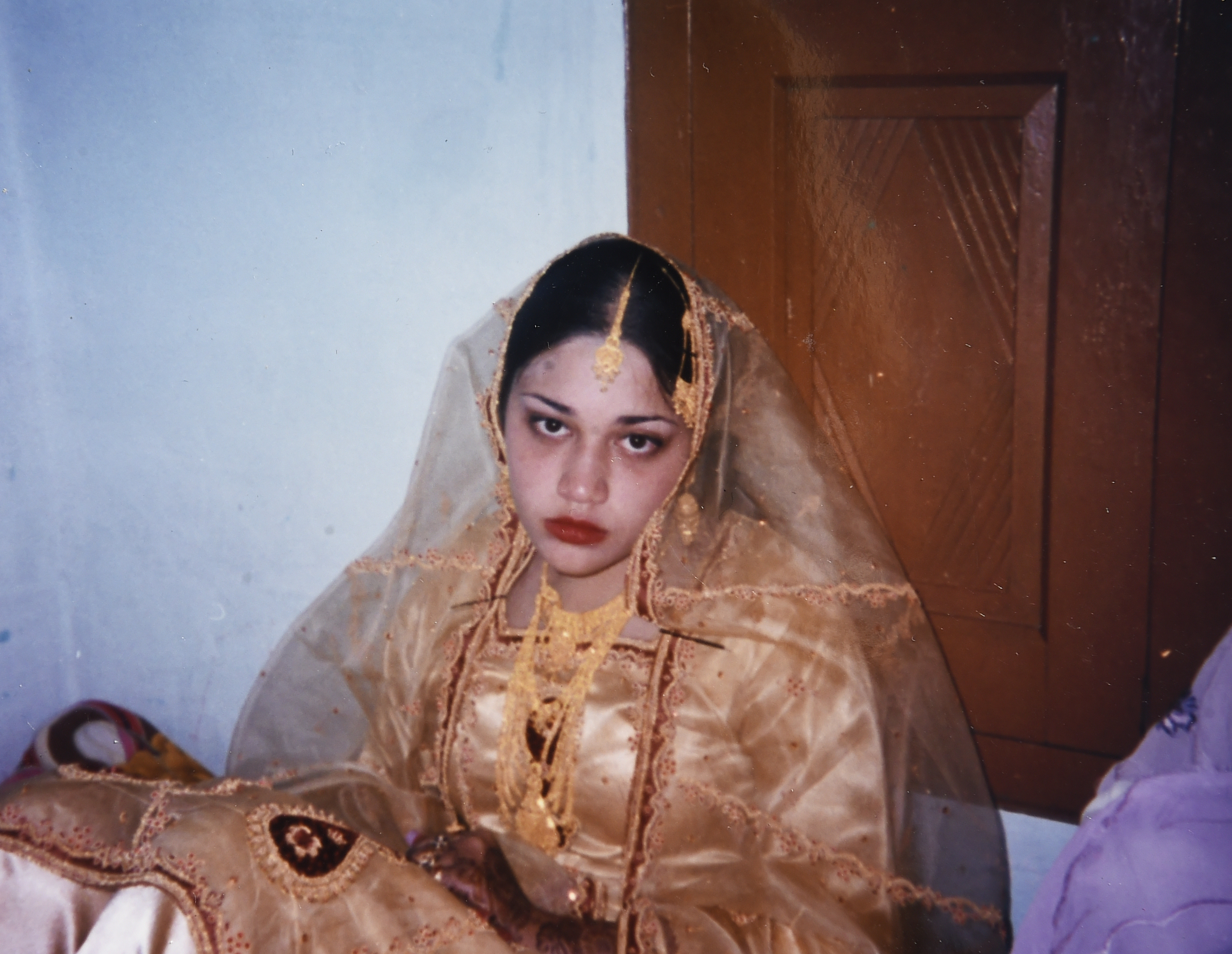 This Jan. 6, 2006, photo provided by Naila Amin shows her at the age of 15, in Pakistan, on the second day of her marriage ceremony.