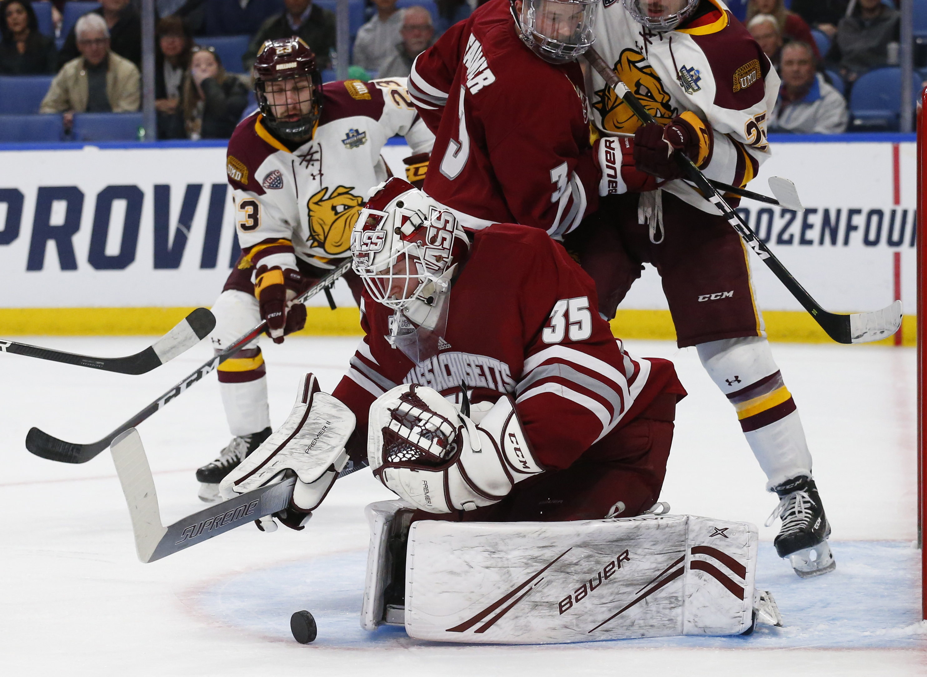 UMass goalie Filip Lindberg makes one of his 28 saves against the Bulldogs.