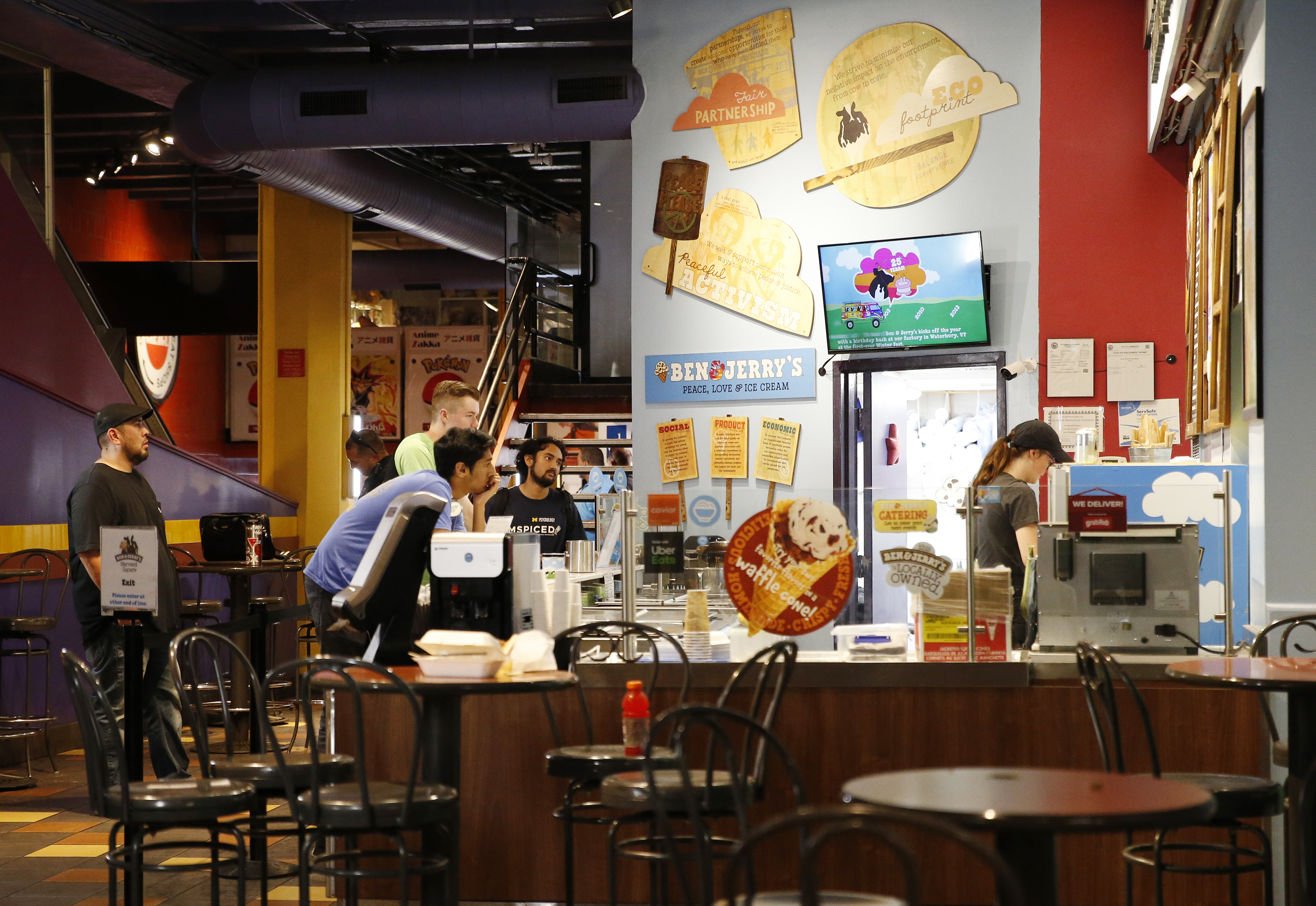 People inside Ben & Jerry's in Harvard Square after Sohan Panjrolia was taken into custody.
