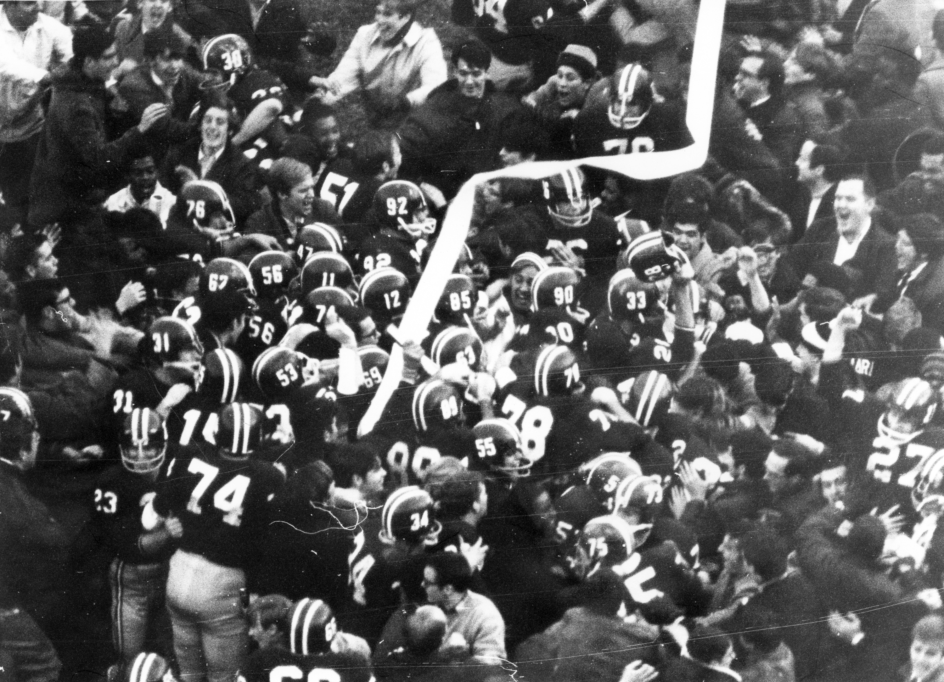 Fans rushed the field after Harvard’s comeback.