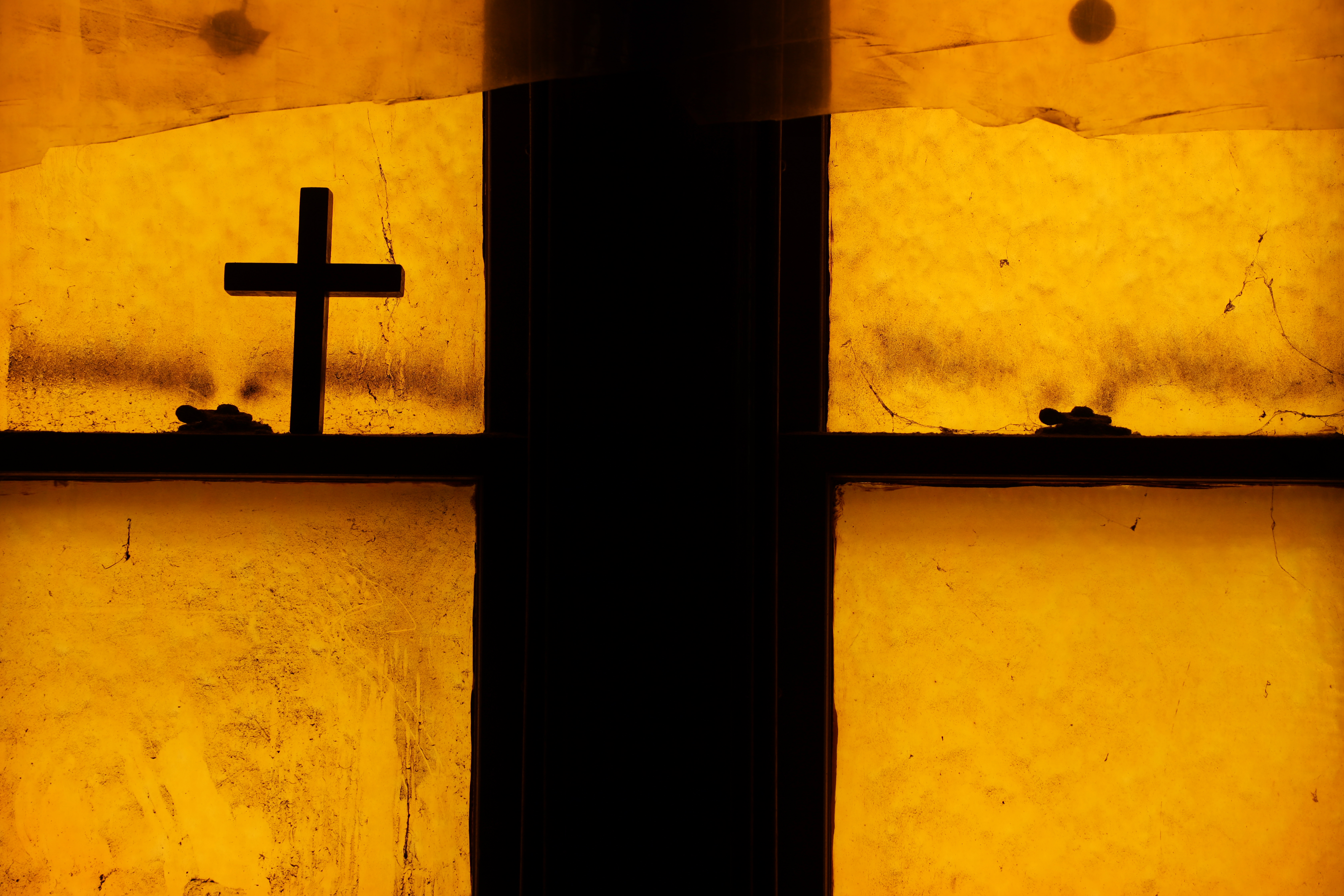A cross rested on a windowsill during an open house.