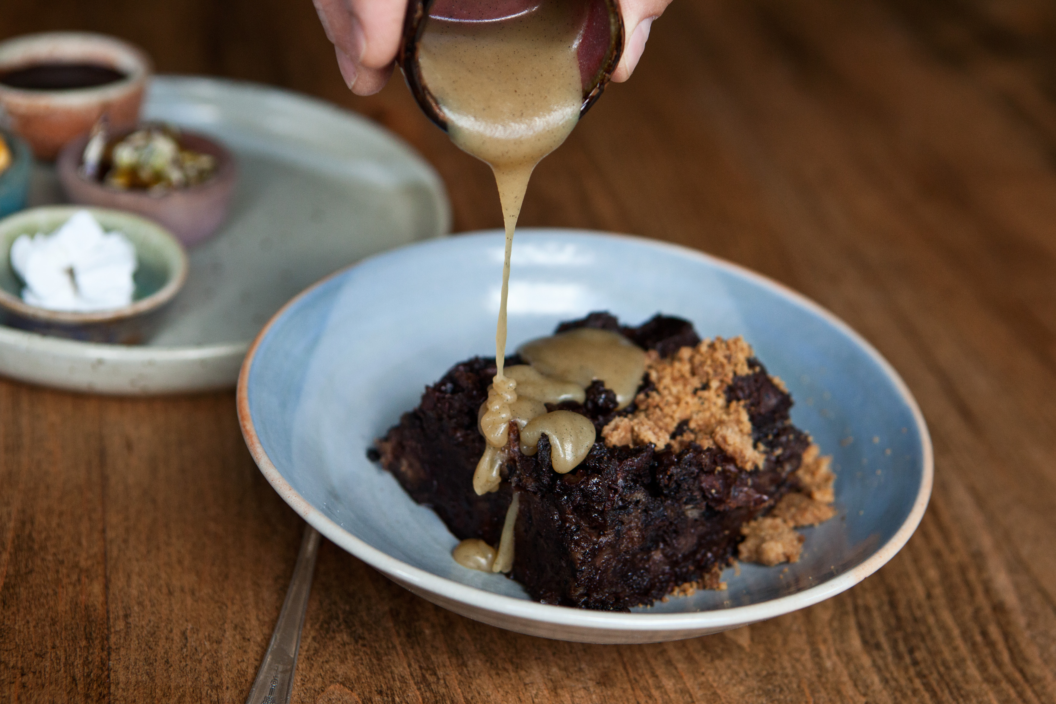 Sourdough chocolate brewis, a bread pudding, drizzled with smoked toffee sauce.
