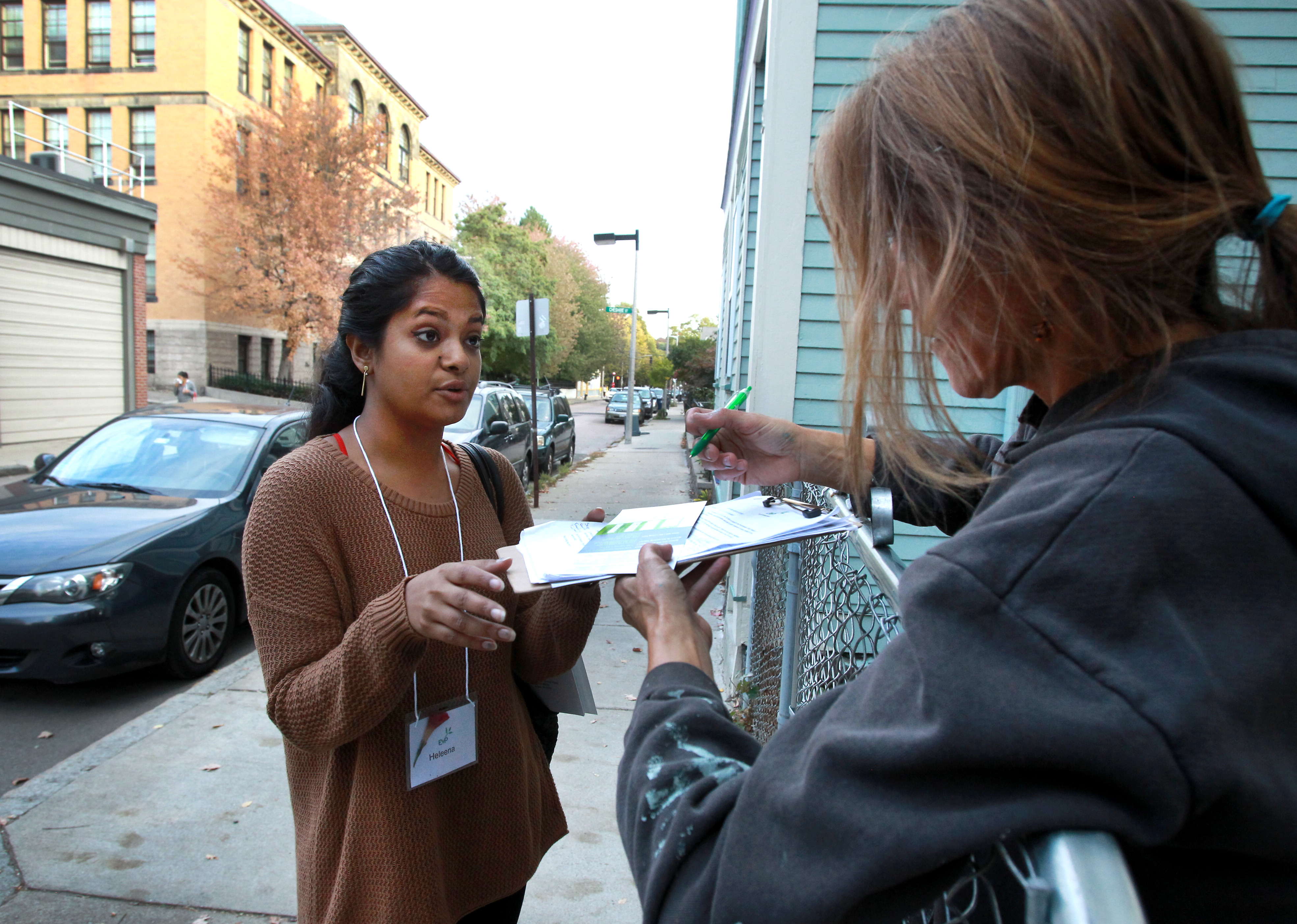 Canvasser Heleena Mathew (left) spoke with Tanya Saar on Green Street in Jamaica Plain.