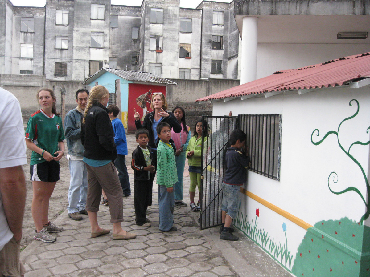 A family volunteers in Quito, Ecuador The Boston Globe