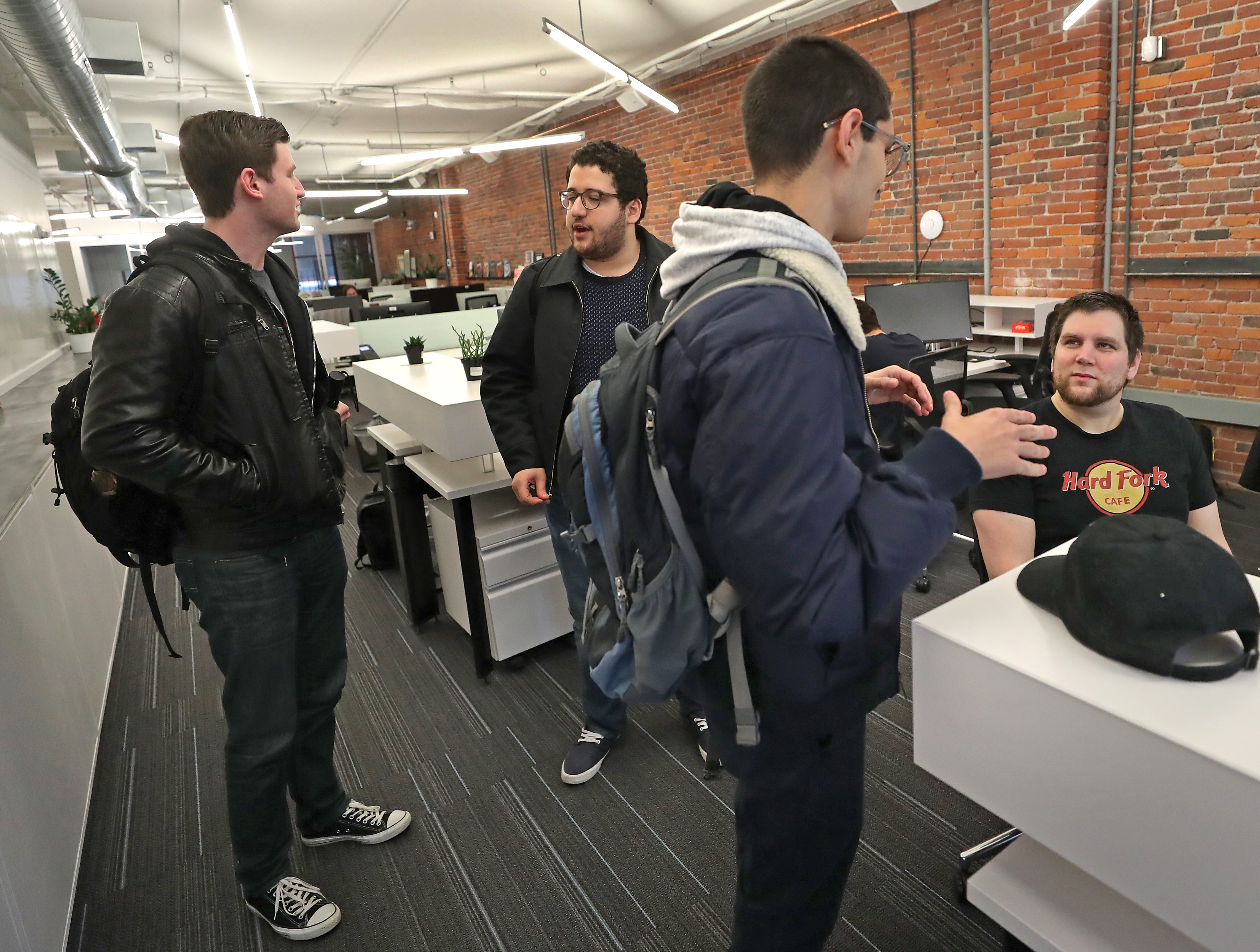 Student interns spoke with Heilman (seated). Arwen aims to make digital currency secure.