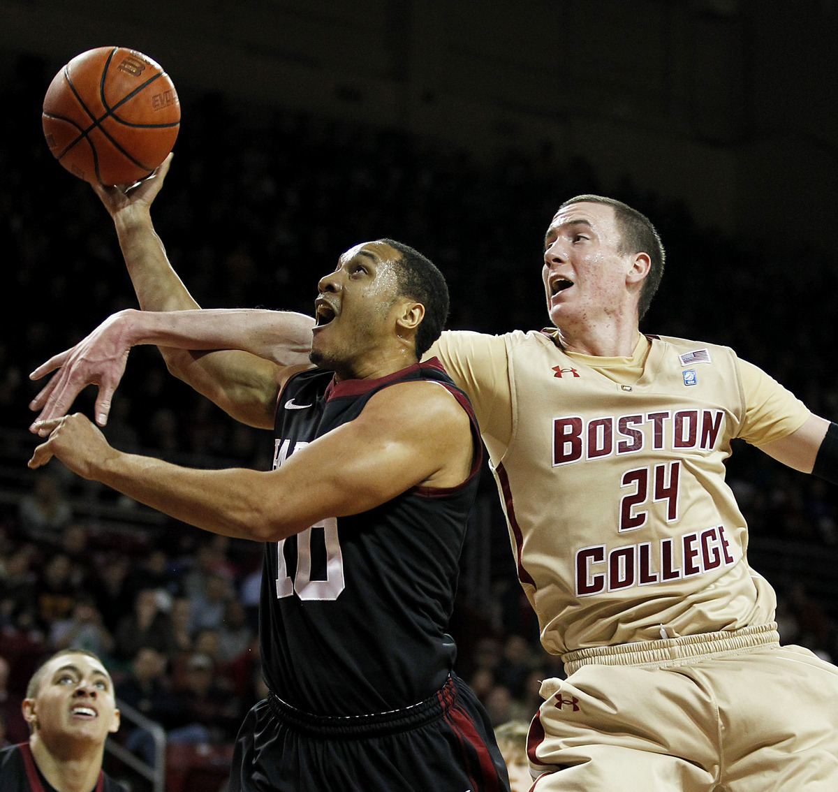 BC’s Dennis Clifford (right) comes over the top on Harvard’s Brandyn Curry, and that’s a foul.