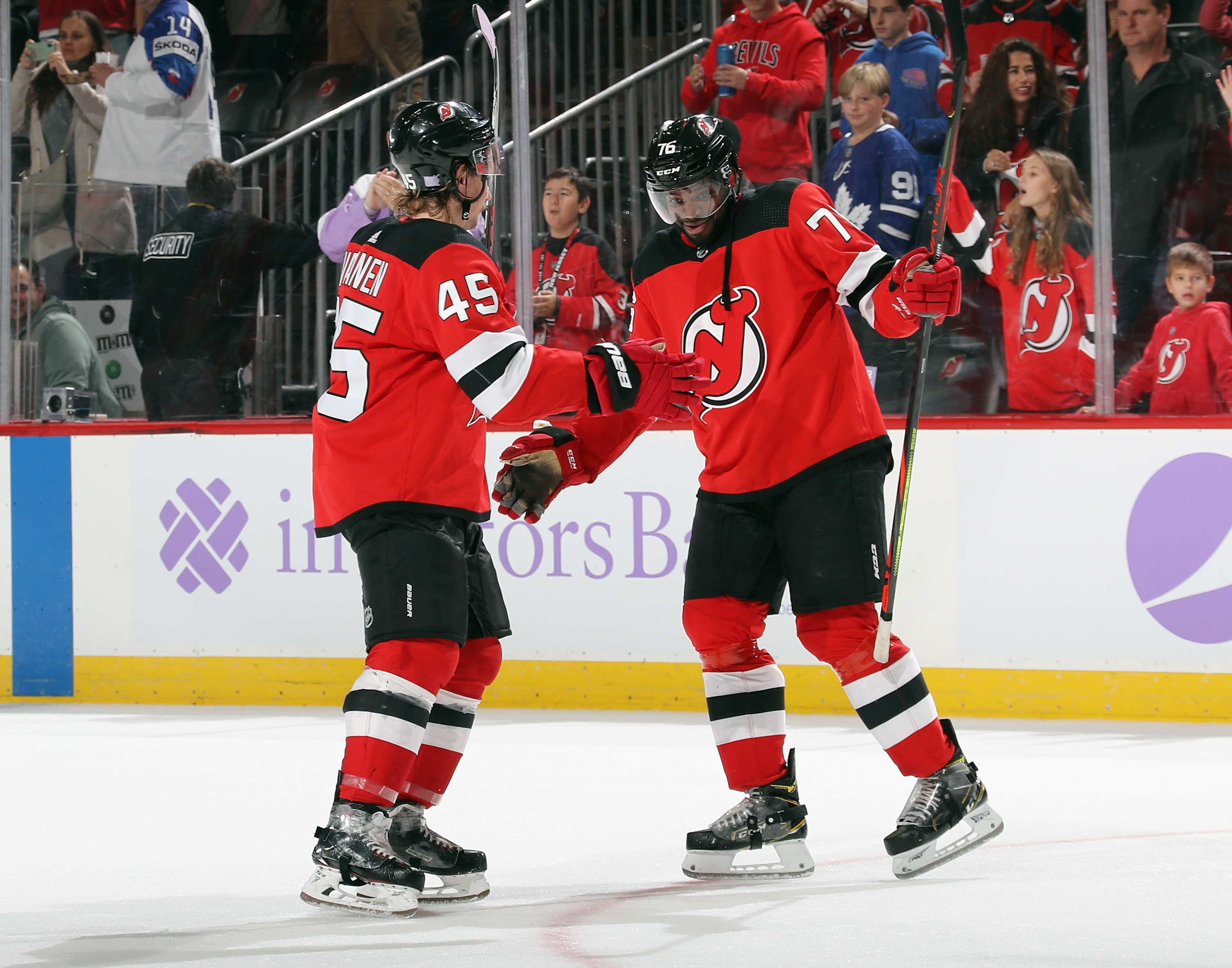 Sami Vatanen #45 and P.K. Subban #76 of the New Jersey Devils celebrate a victory over the Detroit Red Wings at the Prudential Center on Nov. 23, 2019 in Newark, New Jersey. The Devils defeated the Red Wings 5-1.