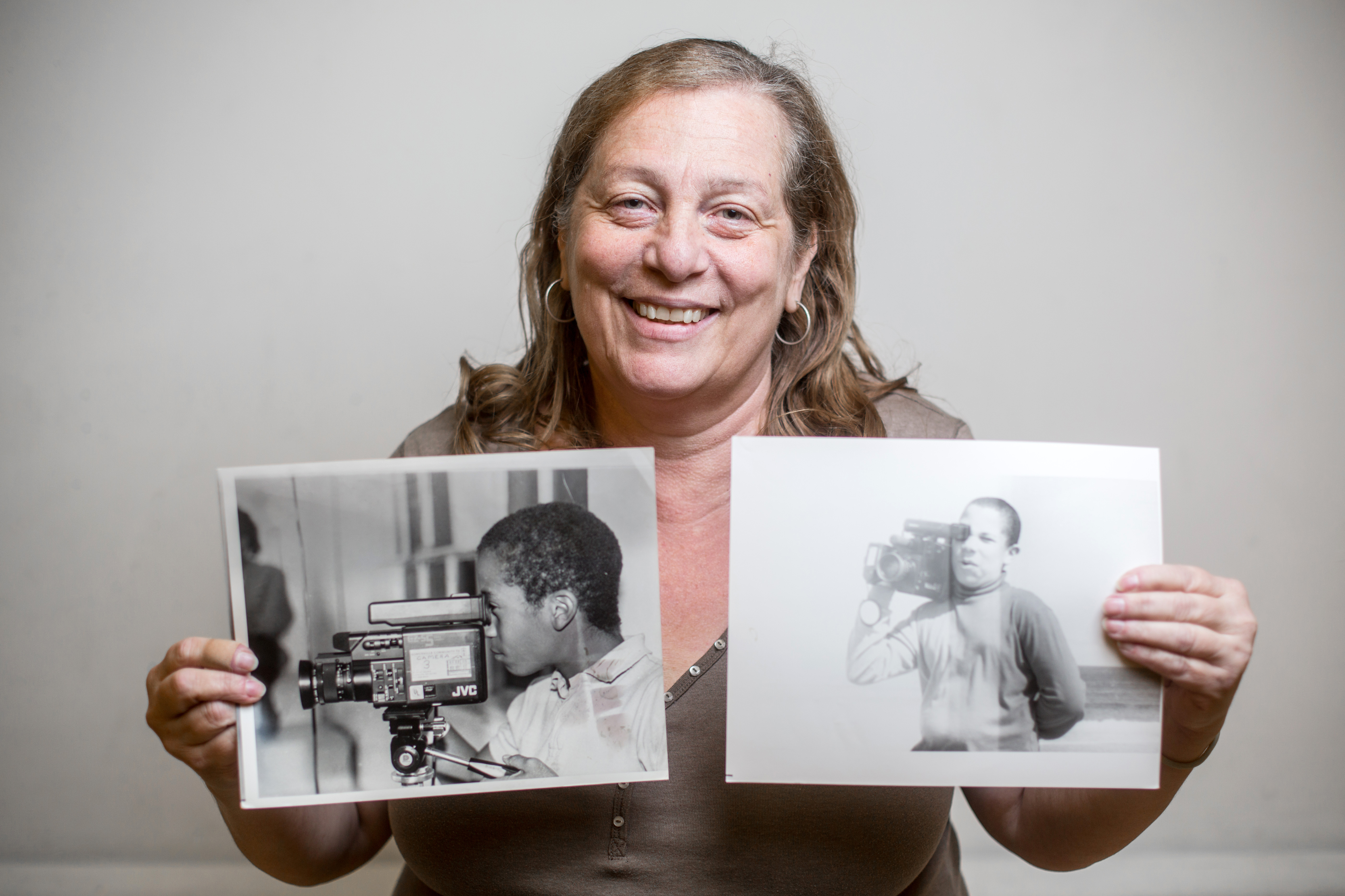 Anna Bellitti with photos of her sons Tyrone (left) and Torin.