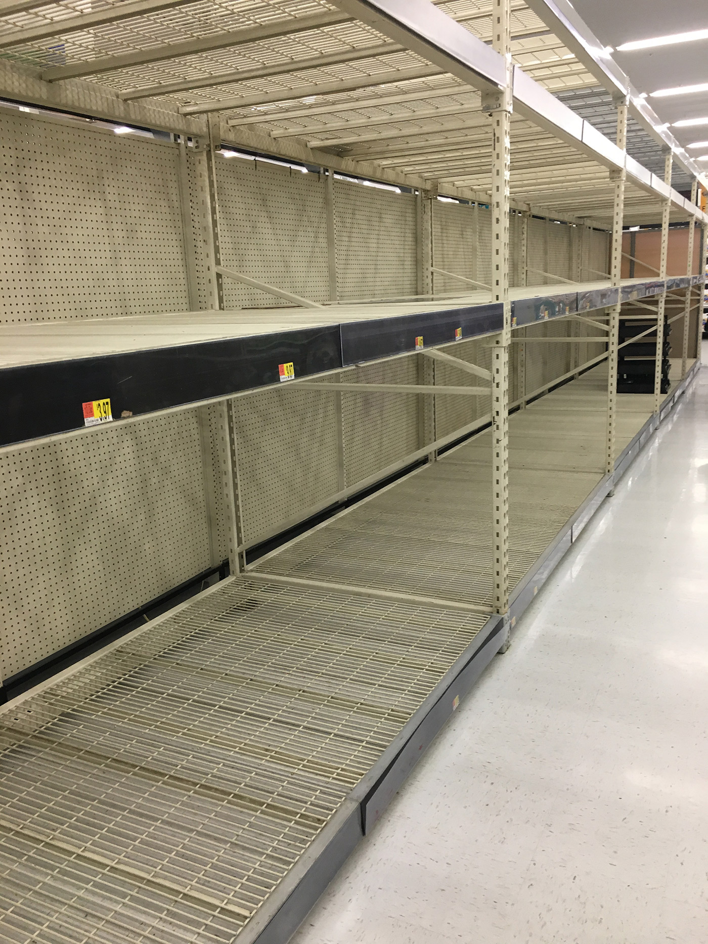 Empty toilet paper shelves at Walmart as people stocked up for the long term during the coronavirus pandemic.