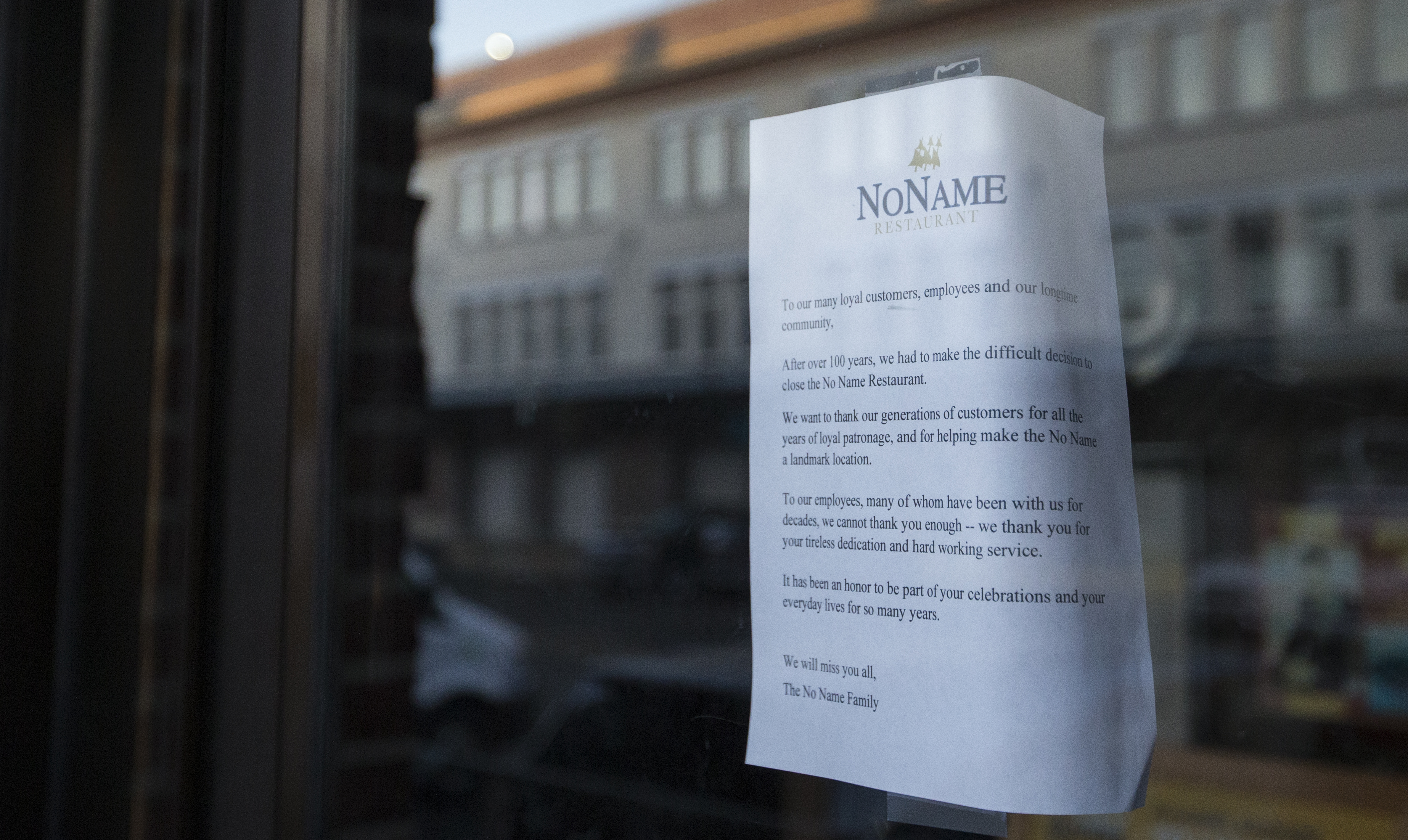 A flier hung in the window of the now closed No Name restaurant. No Name, shuttered at the end of 2019, had been in business for over 100 years.