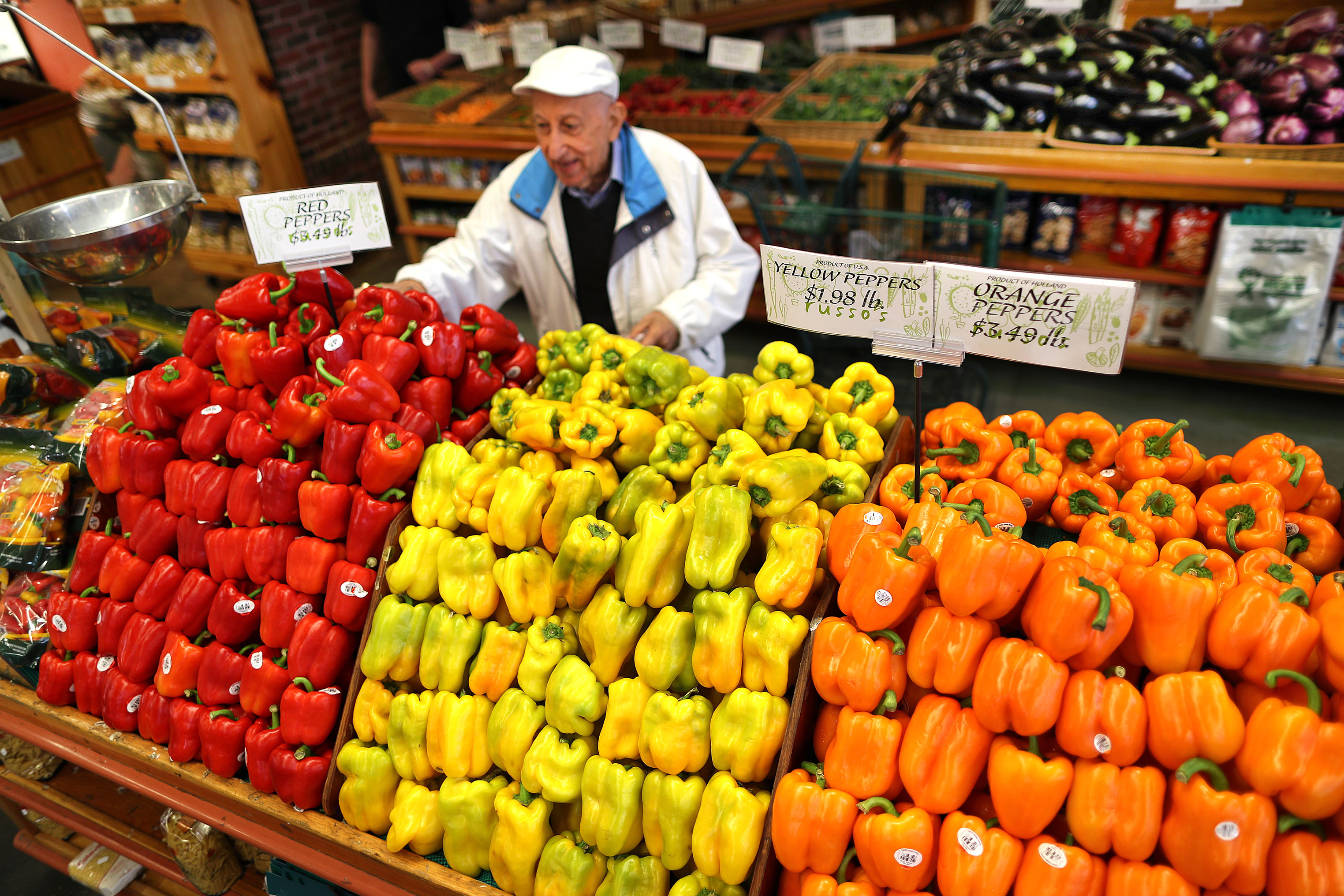 Customer Ara Chamlian from Watertown picks some peppers at Russo's.