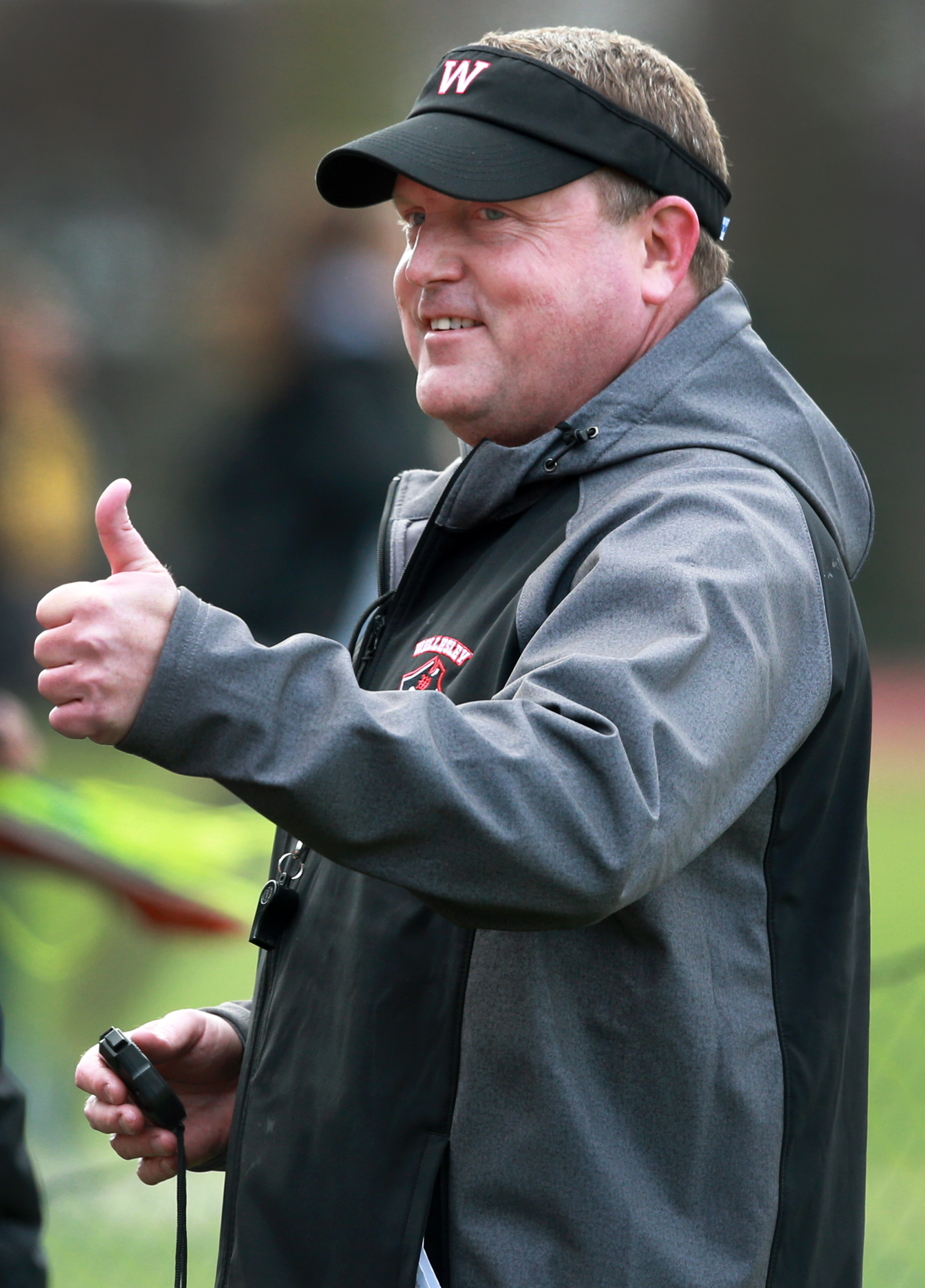 Coach John Griffith likes what he sees during Wellesley’s meet against Framingham.