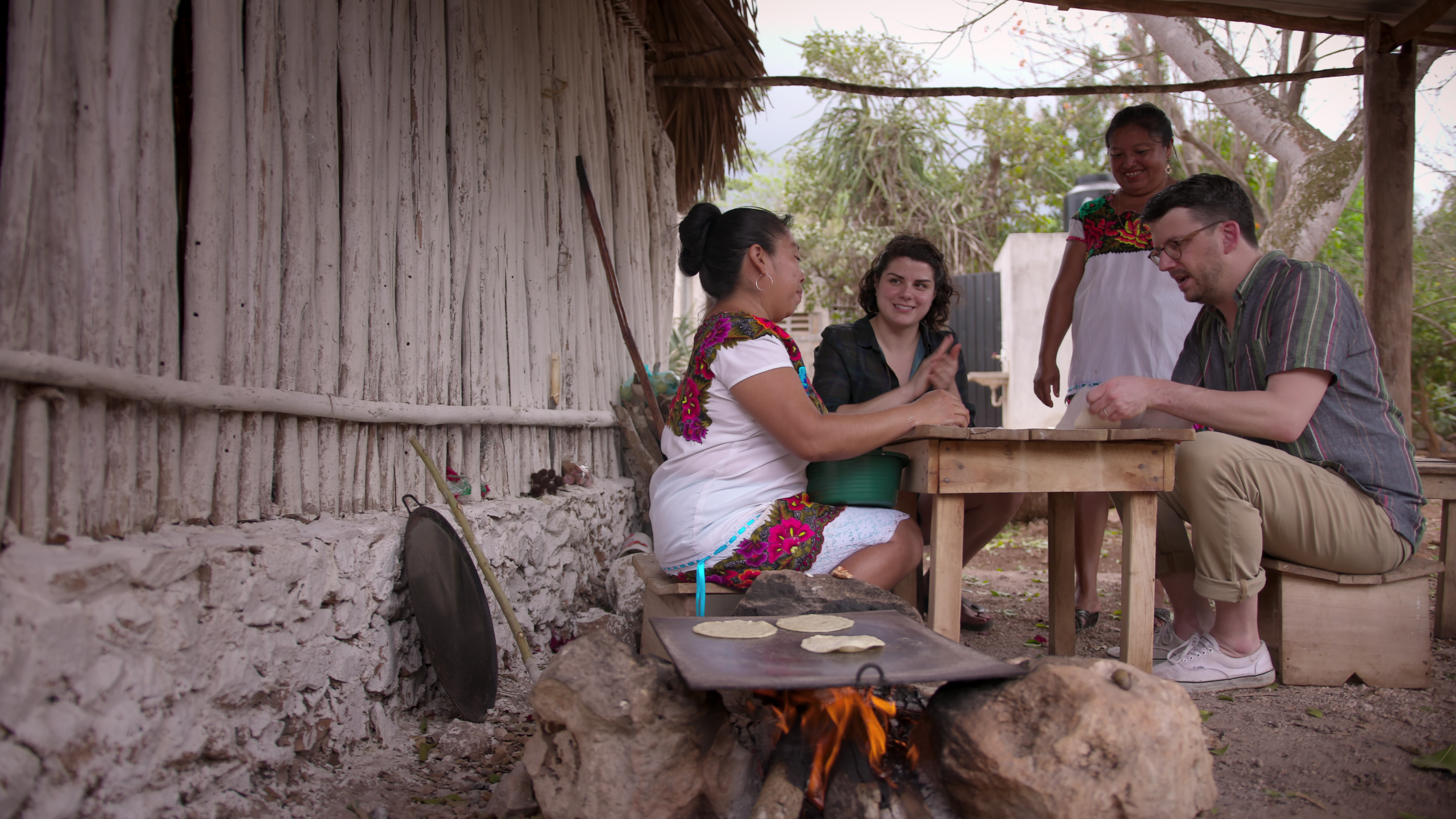 Food writer Peter Meehan (far right) and chef Rosio Sanchez (second from left) make tortillas with chefs in Yaxunah, Mexico.