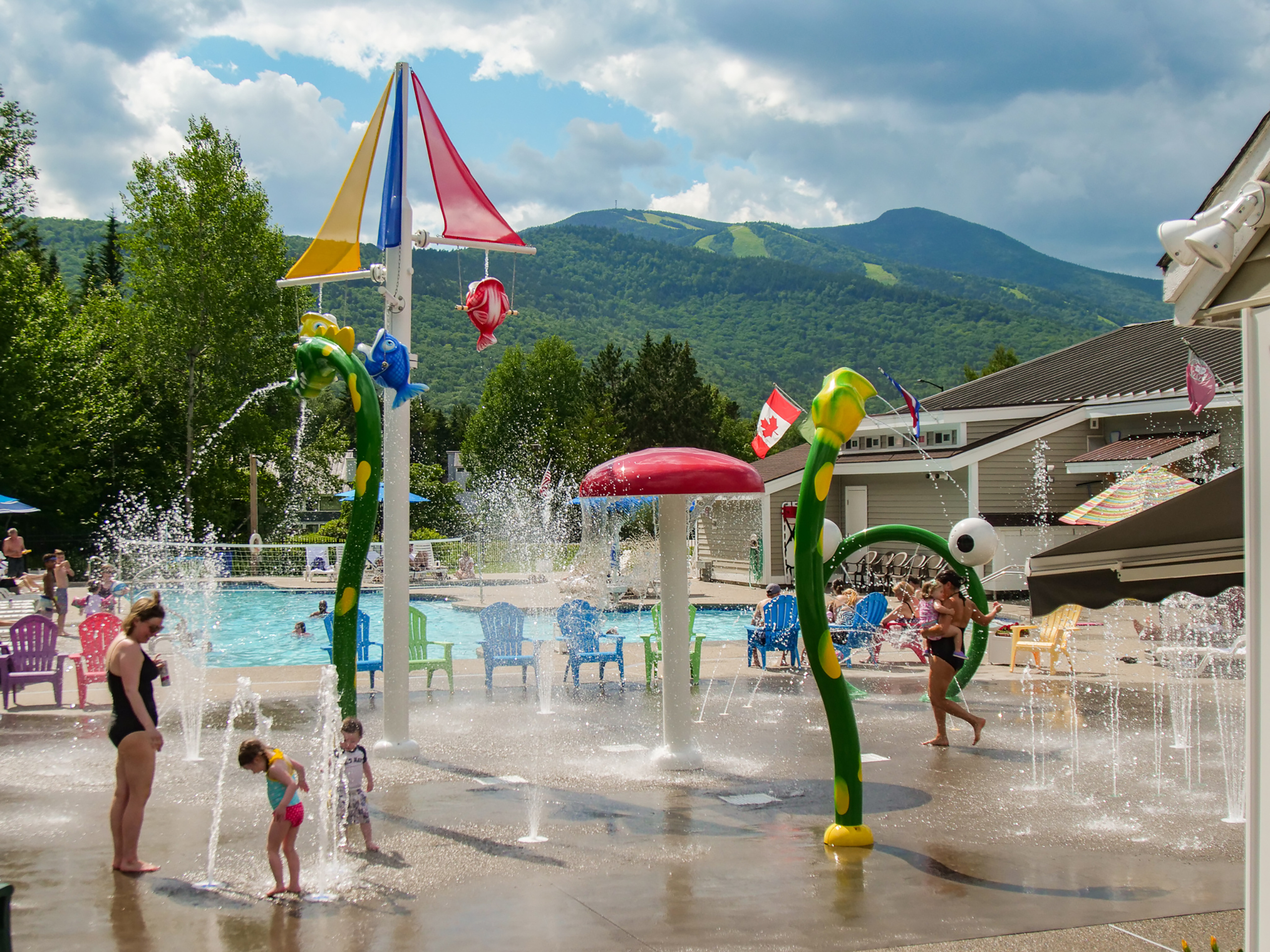 The outdoor swimming pool at Waterville Valley Resort is a popular spot for vacationing families.