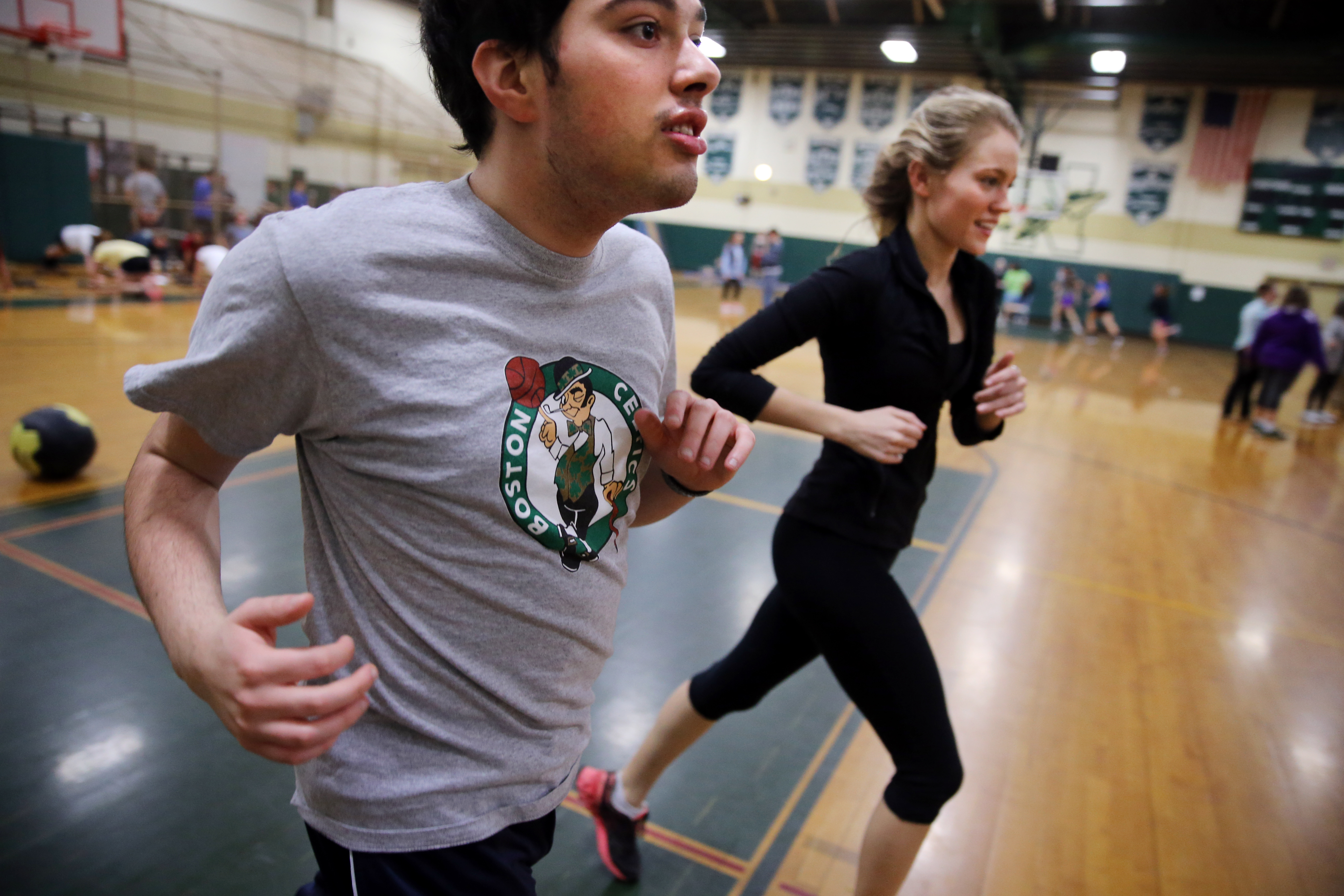 Cabral, left, ran with senior Mary Sabourin during the Unified Track program at Nashoba Regional High School in Bolton.