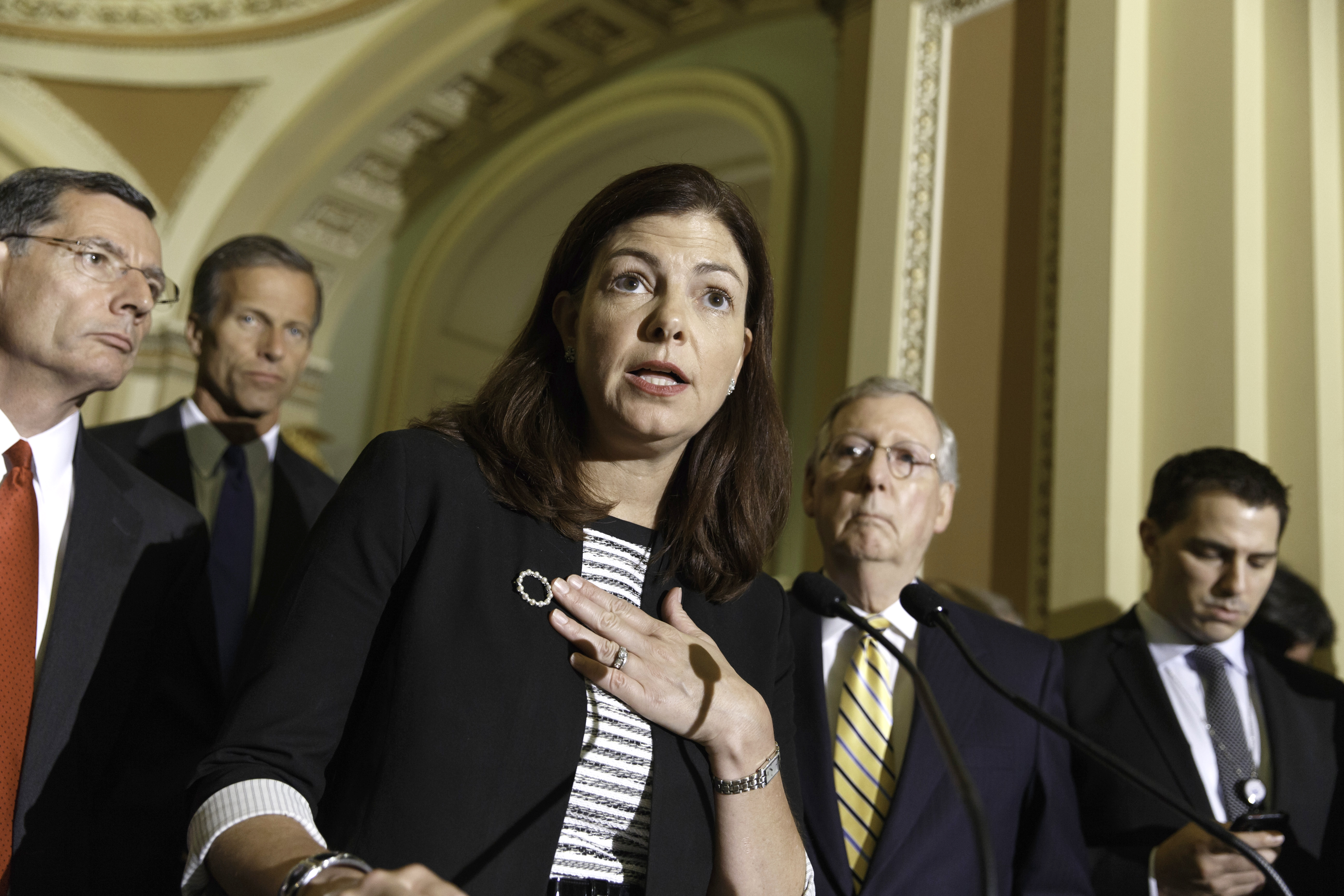 Senator Kelly Ayotte spoke to reporters about competing bills from the Democrats and Republicans on employee health coverage and birth control under the Affordable Care Act.
