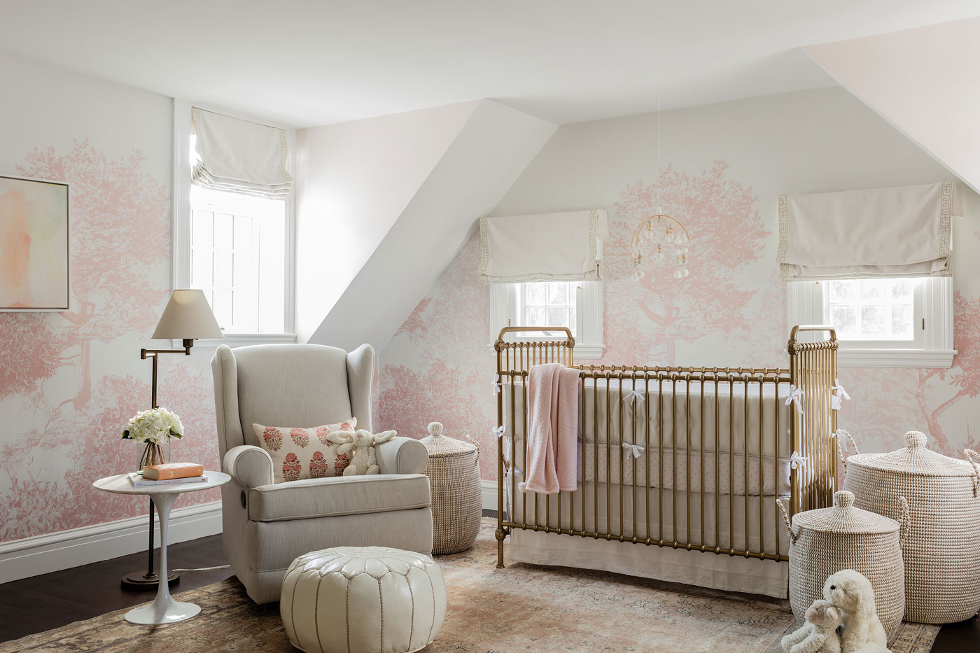 The Hua Trees mural wallpaper by Sian Zeng covers two walls in the nursery. Aside from the antique brass finished iron crib from RH Baby & Child, “Nothing is very juvenile, so she can keep it forever or repurpose elsewhere,” says Gates.