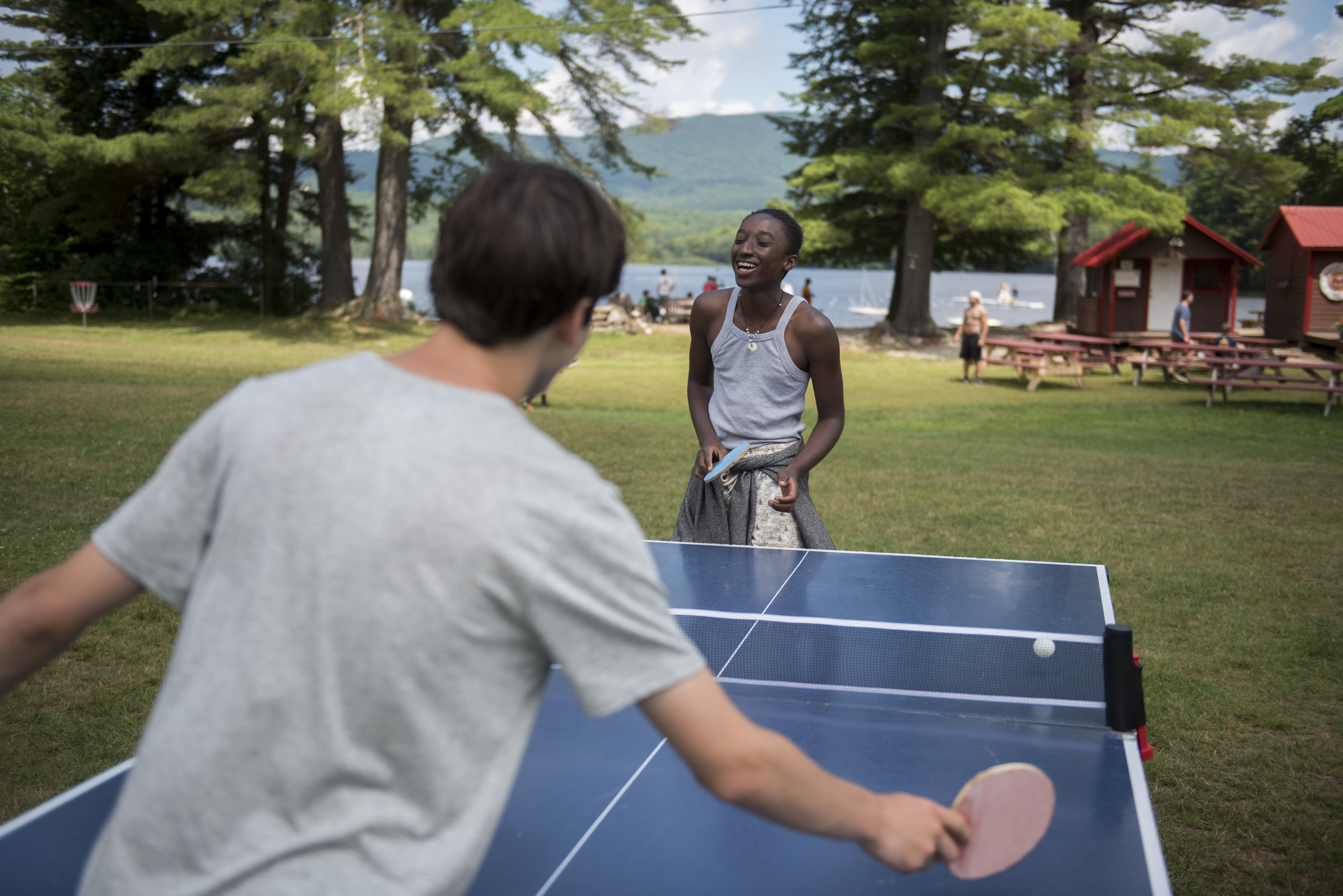 Long-time friends Jacob Smith, right, and David Falis played ping-pong during a sunny morning.