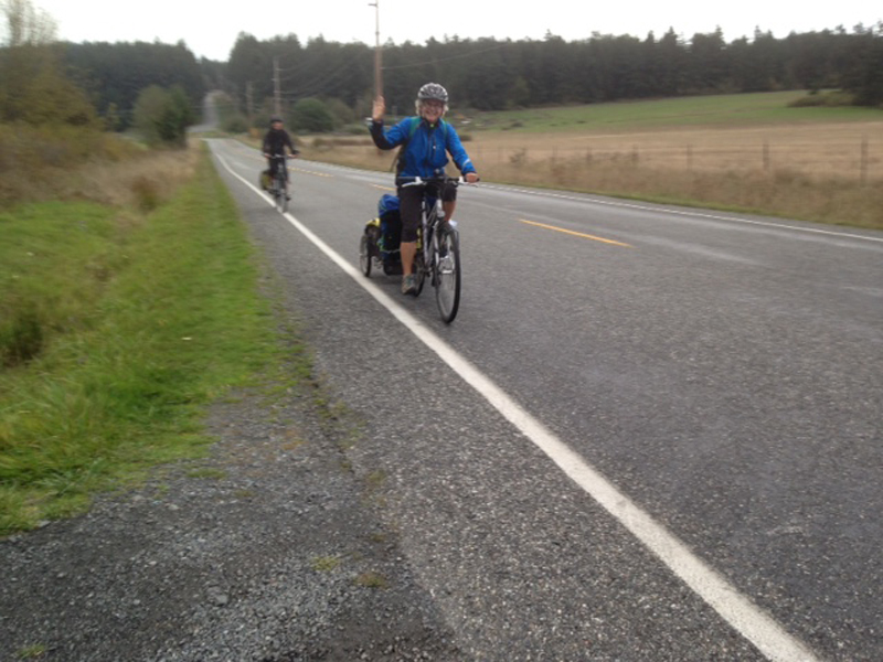Kathleen leads Sherry going uphill on Lopez Island.