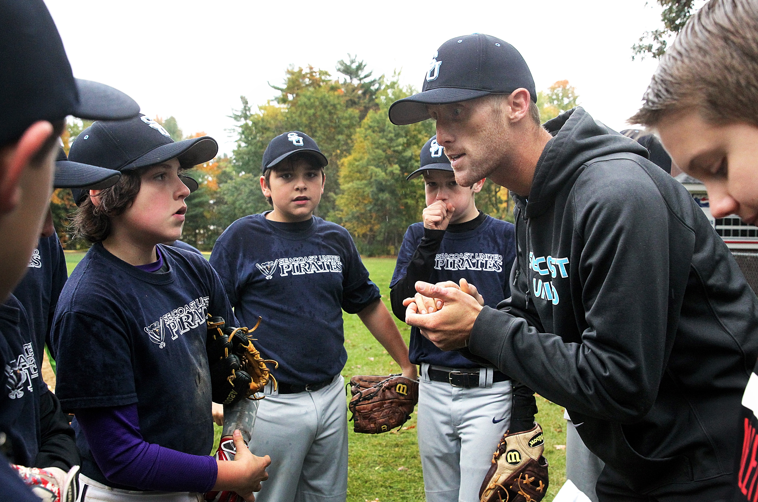 Coach Eric Wells of Seacoast United Navy addresses his team earlier this month.