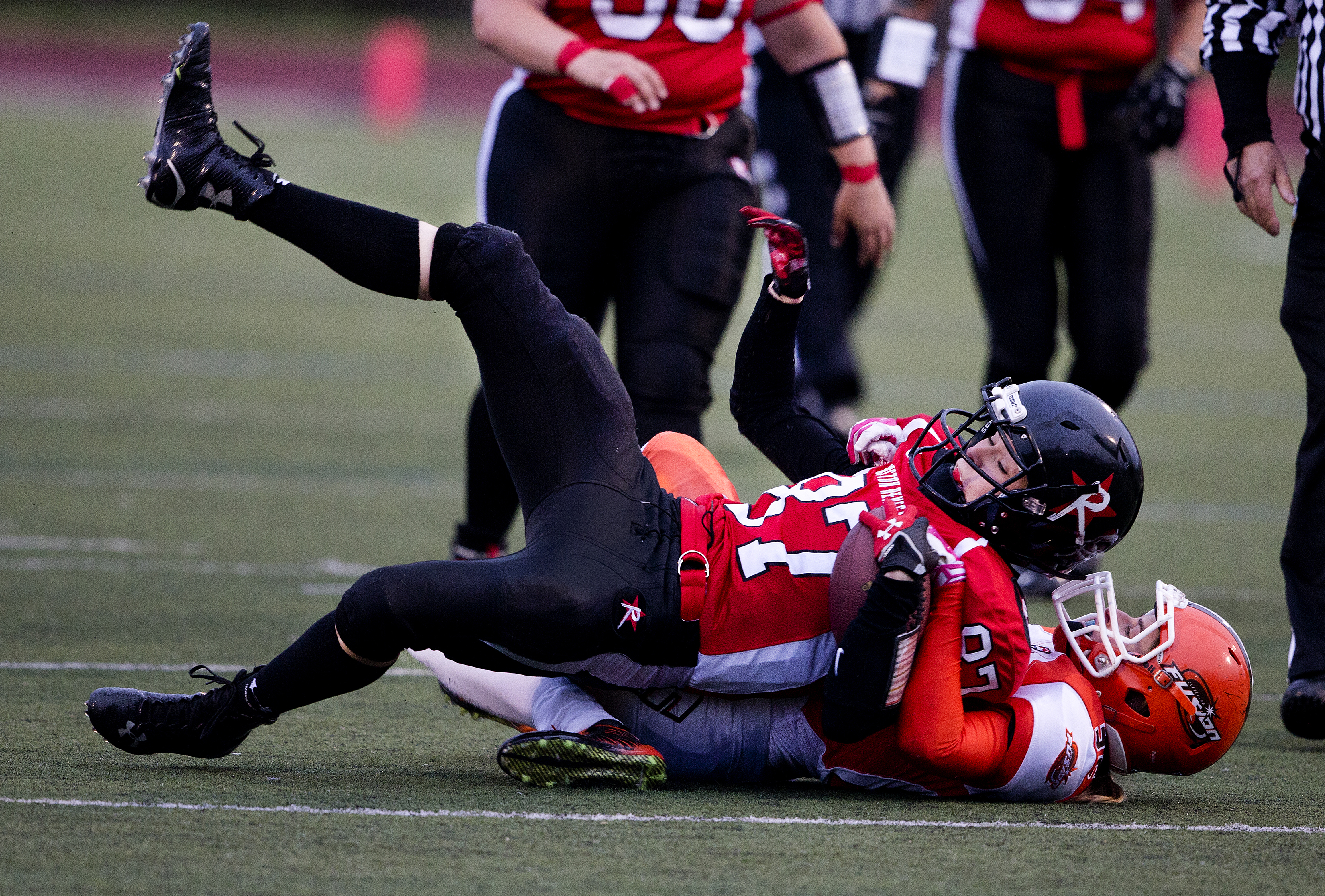 Renegades receiver Emily Beinecke is tackled after a reception.