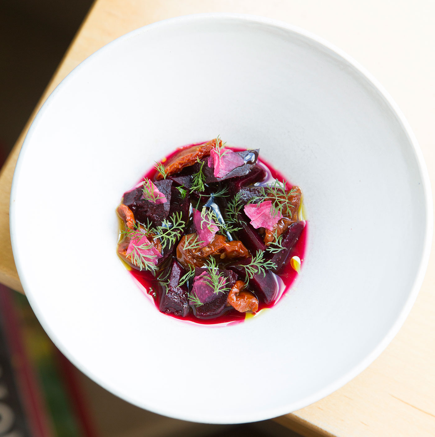 Beets center this first course with dried cherry tomatoes, dill, and salted beach rose at birch, one of Benjamin Sukle’s standout restaurants in Providence.