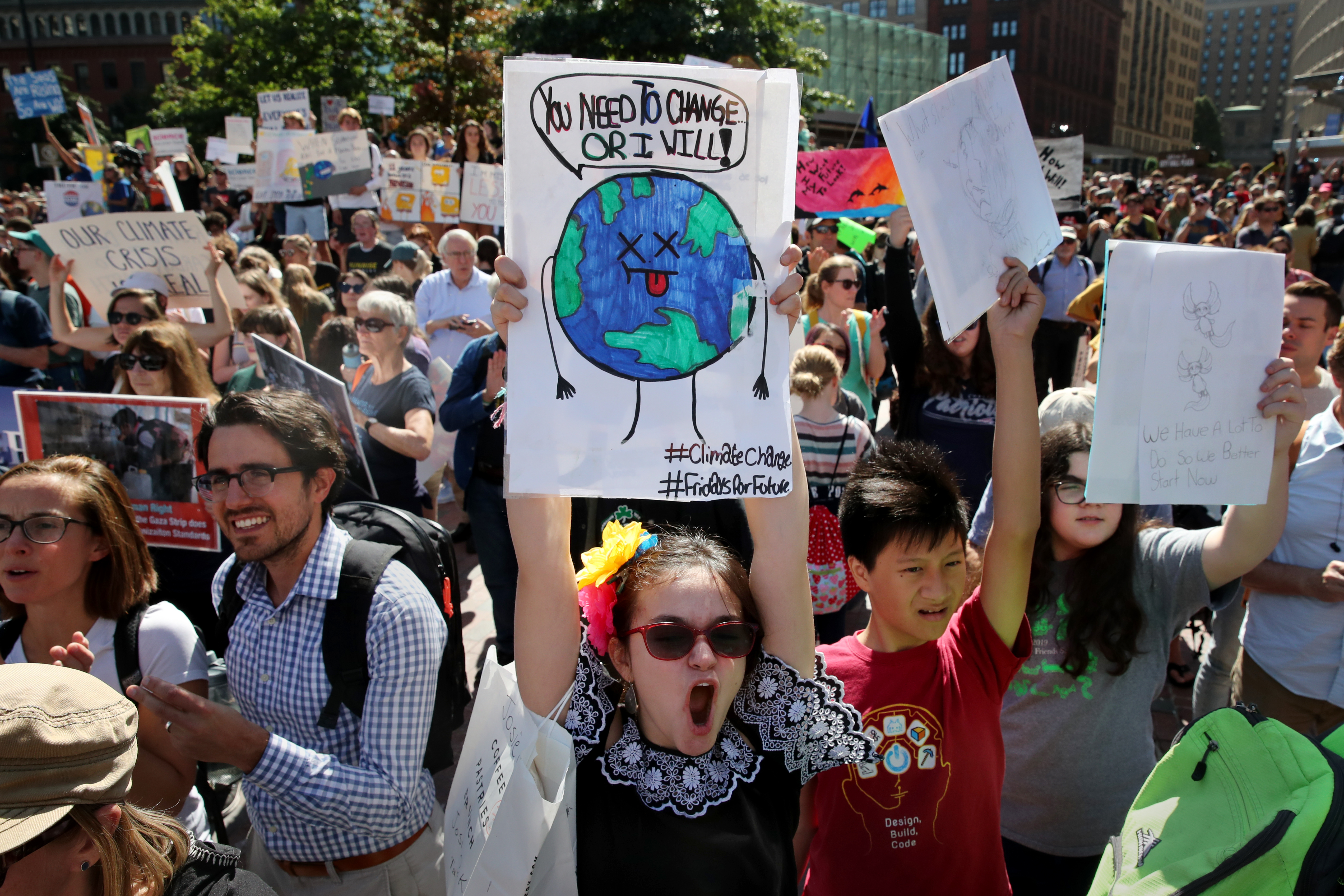 Josie Carvajal Kossnar, 12, of Cambridge cheered during the strike in Boston on Friday.
