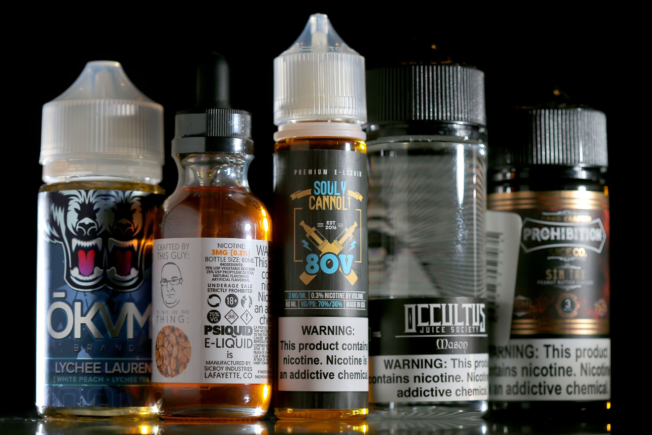 Bottles of flavored nicotine e-liquid at The Vape Shop in Brighton.