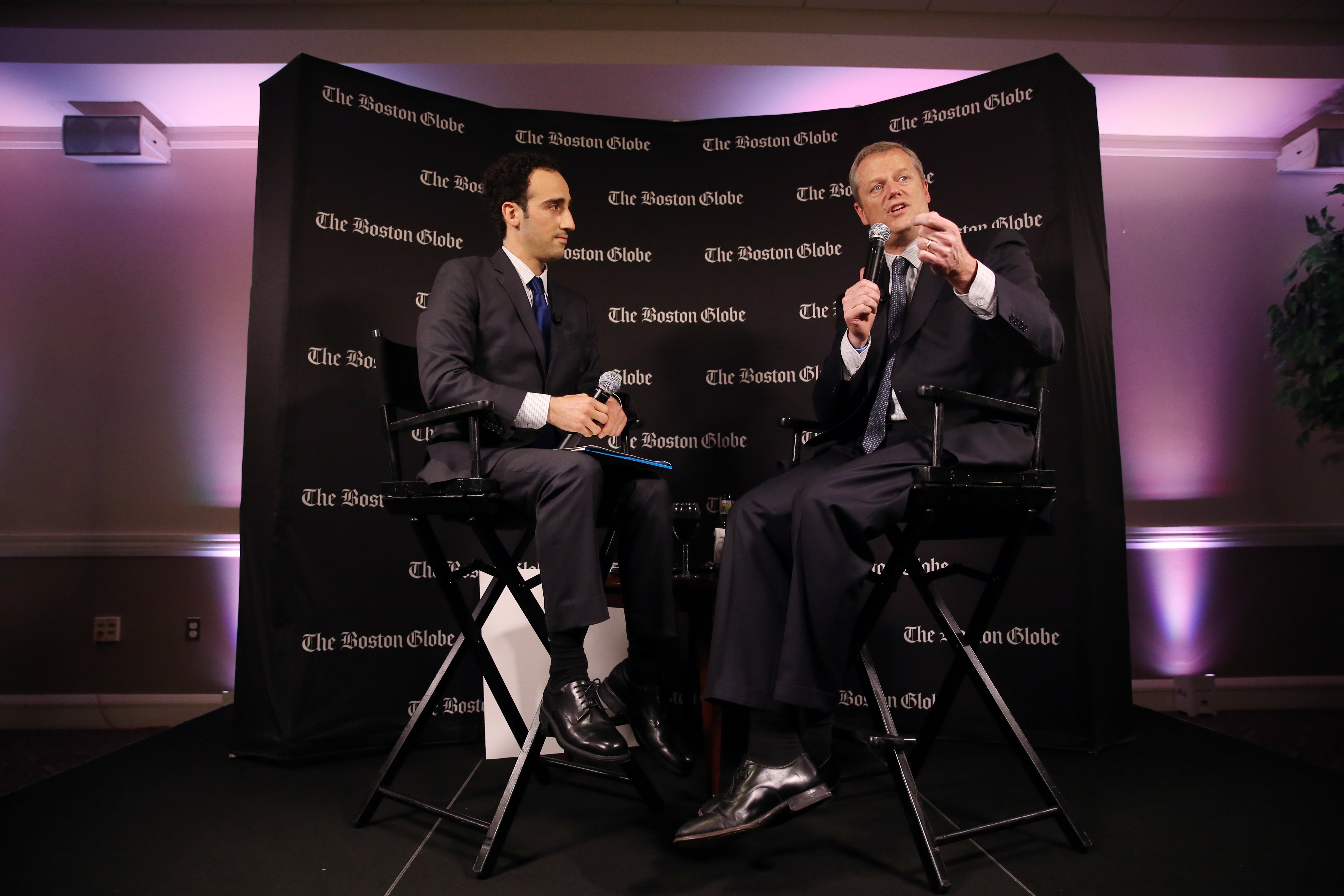 Governor Charlie Baker chated with Boston Globe political reporter Joshua Miller during Political Happy Hour at Suffolk University Law School.