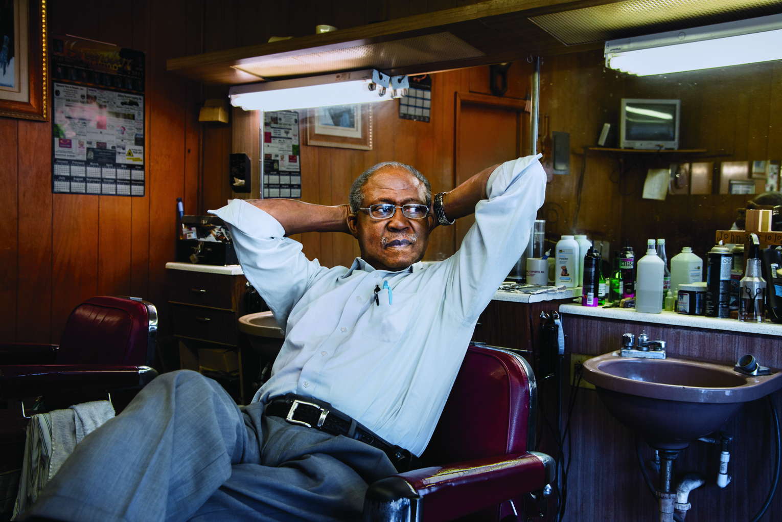 Barber Eugene Lyles relaxes in his Alabama shop.